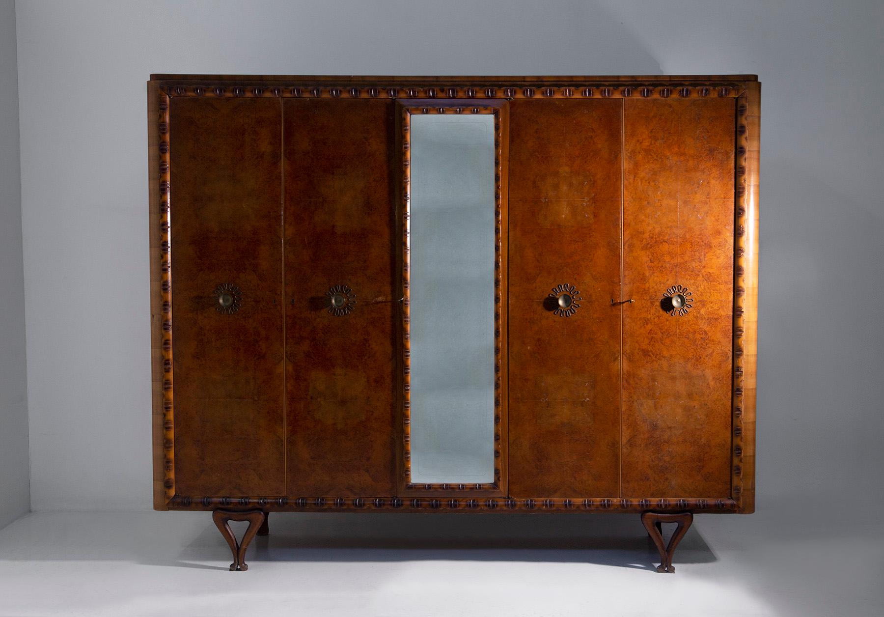 Enter the enchanting world of Italian craftsmanship of the 1950s, where every piece of furniture was a work of art and elegance was paramount. This exquisite wardrobe , attributed to Paolo Buffa, is a testament to the refined sensibility of the era,