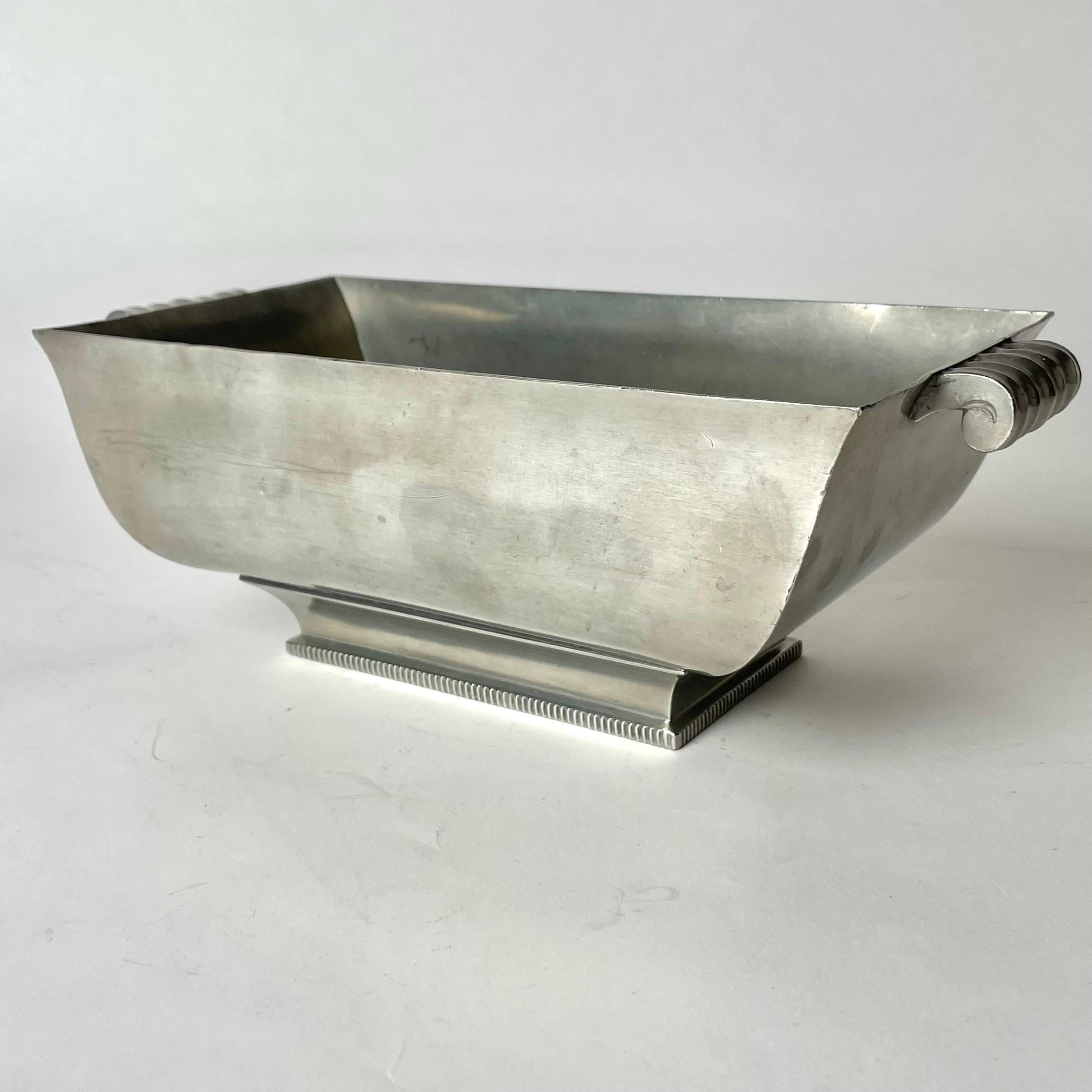 Elegant Jardiniere in Pewter by GAB Guldsmedsaktiebolaget, Sweden. Typical Swedish Art Deco / Swedish Grace and marked GAB TENN (pewter) and G8 which means it was manufactured in 1933.

Wear consistent with age and use