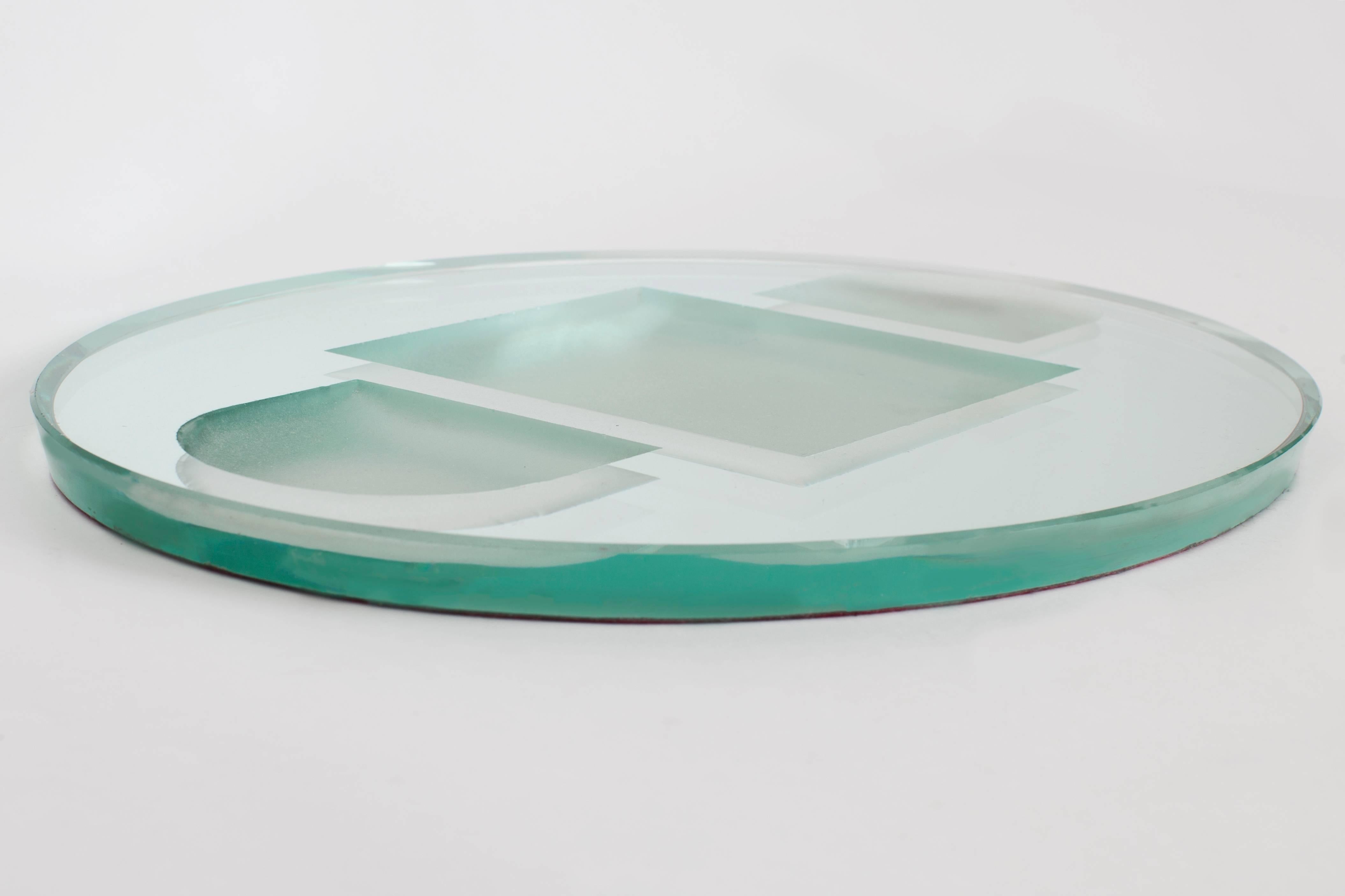 France, 1950's

A thick, modernist oval tray or vide-poche, in mirrored glass and frosted glass, with sand-blasted geometric motif in deep relief. In the purified Art Deco style of avant-garde glassware designer Jean Luce, a collaborator of Jean