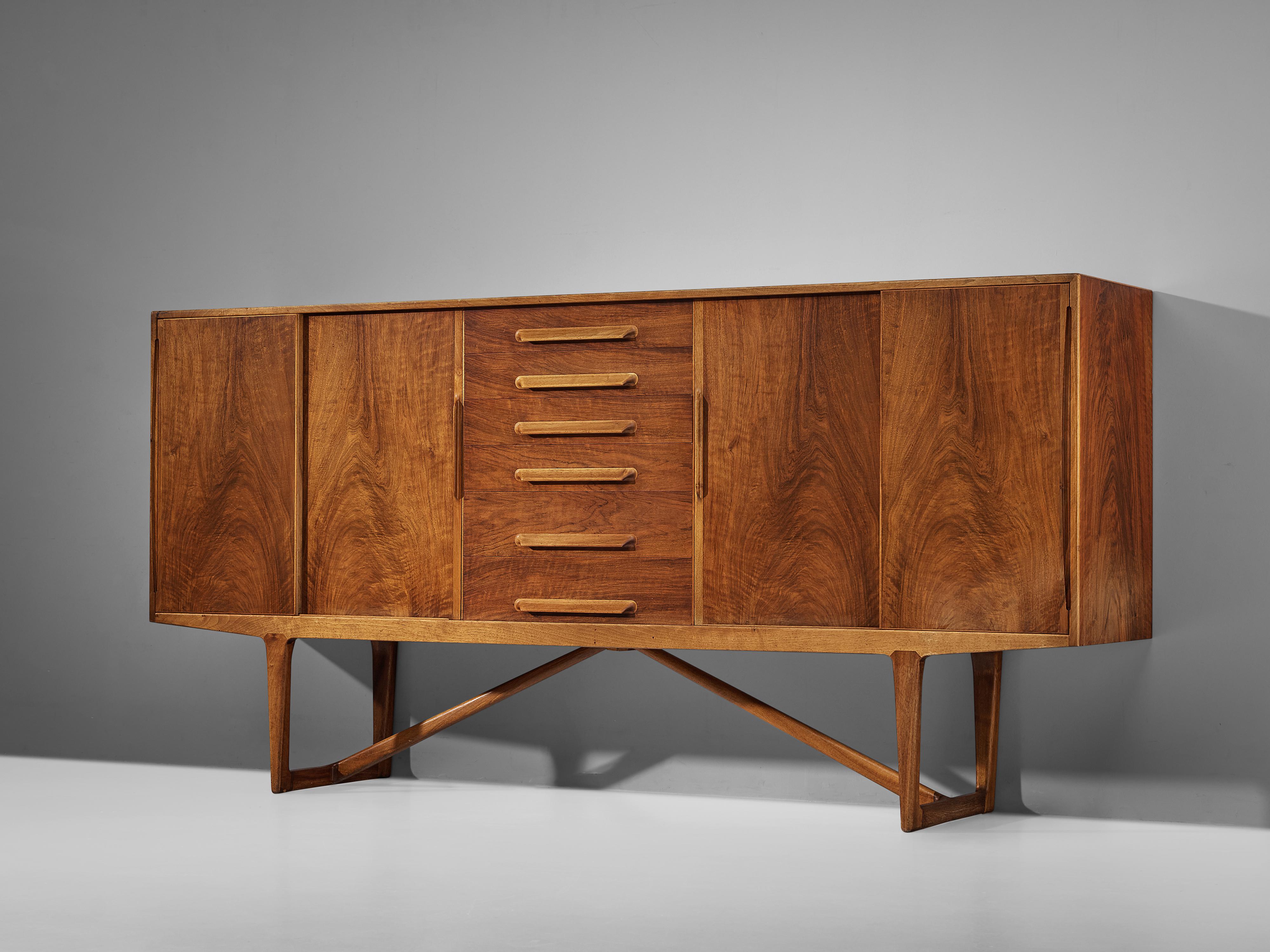 Kurt Østervig, sideboard, walnut, Denmark, 1950s

Sophisticated walnut sideboard by Kurt Østervig. The quality of this piece is reflected in the very well made seamless wooden joints and door grips, as well as the warm grain of the walnut veneer.