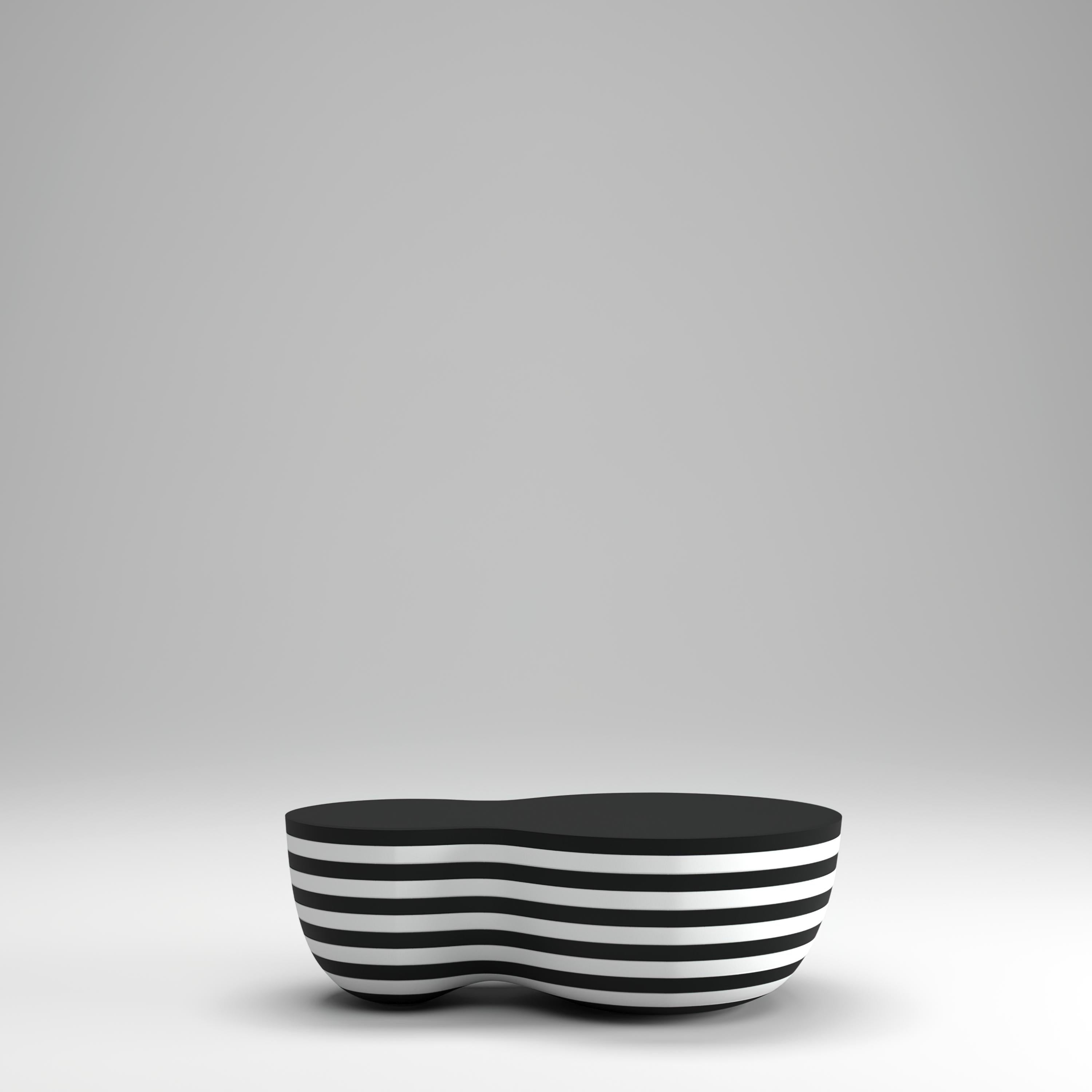 The NUT coffee table was conceived as an experiment in curvilinear forms. Designer Yuriy Zimenko combined the flat rhythm of monochrome MDF layers with a curved shape. The elegant twists of the wood-derived material are achieved with a sophisticated