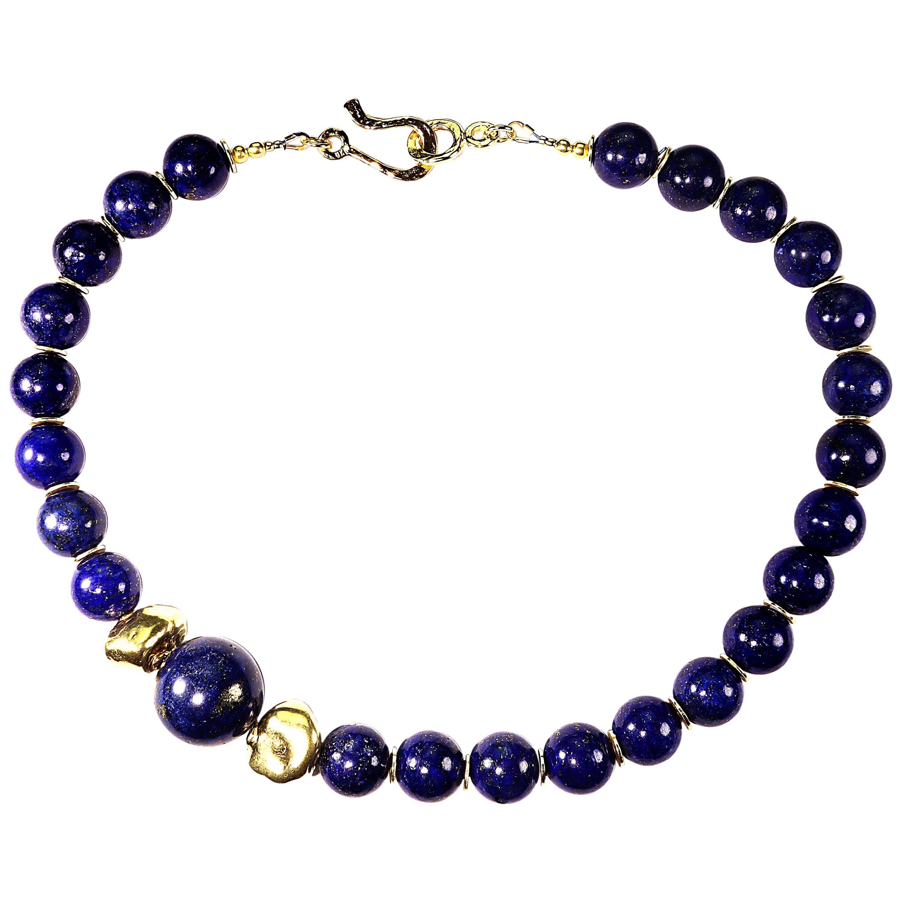 16 Inch elegant, handmade choker necklace of highly polished Lapis Lazuli with an off center focal of two golden toned nuggets and one 18MM Lapis Lazuli sphere. This 16 inch choker is secured with a 14K gold vermeil hammered hook and eye clasp. Wear