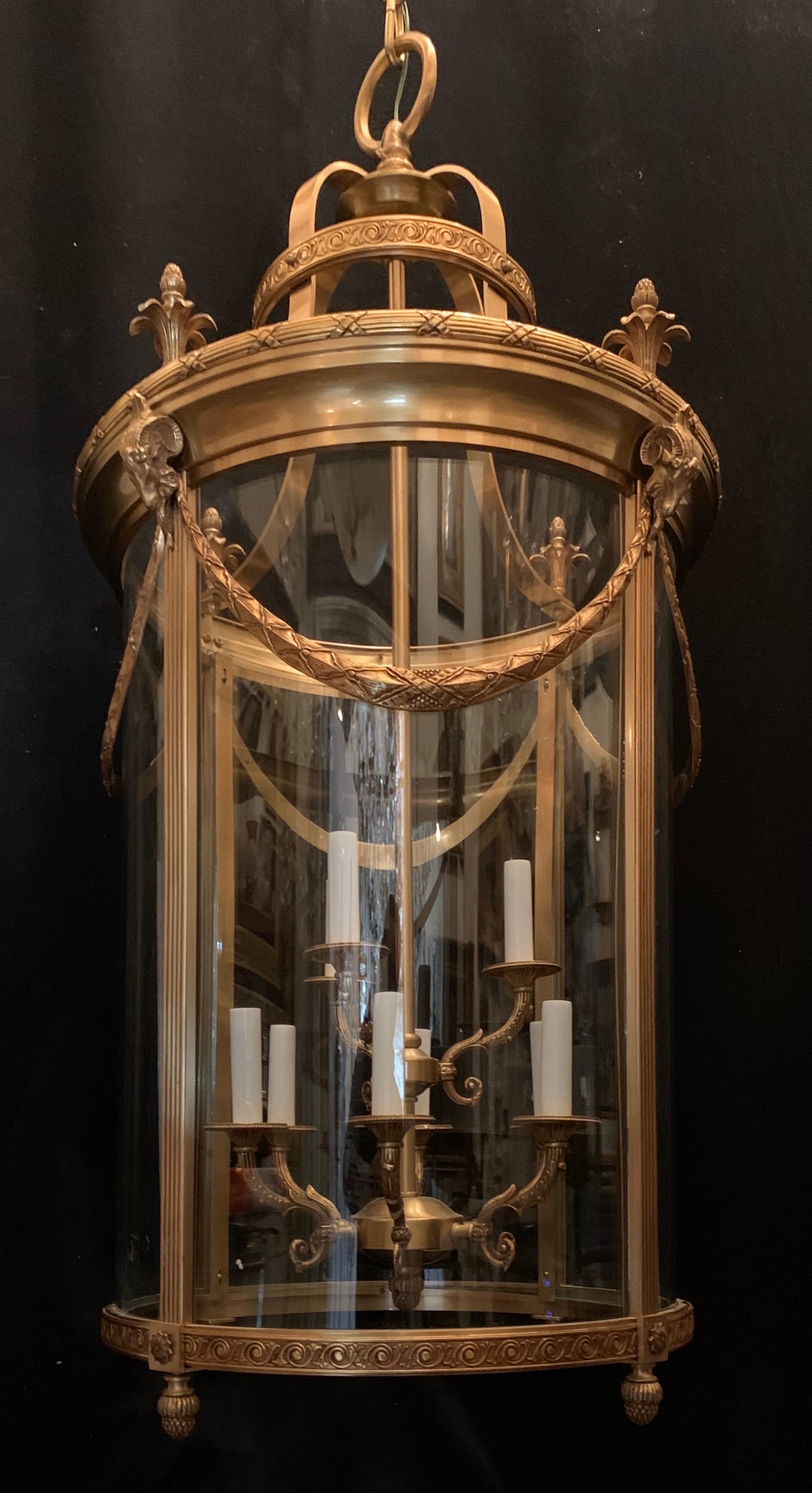 Elegant large gilt bronze Louis XVI neoclassical Empire style two-tier lantern fixture with curved glass panels, rewired with 9 candelabra lights and ready to install in an entry foyer.