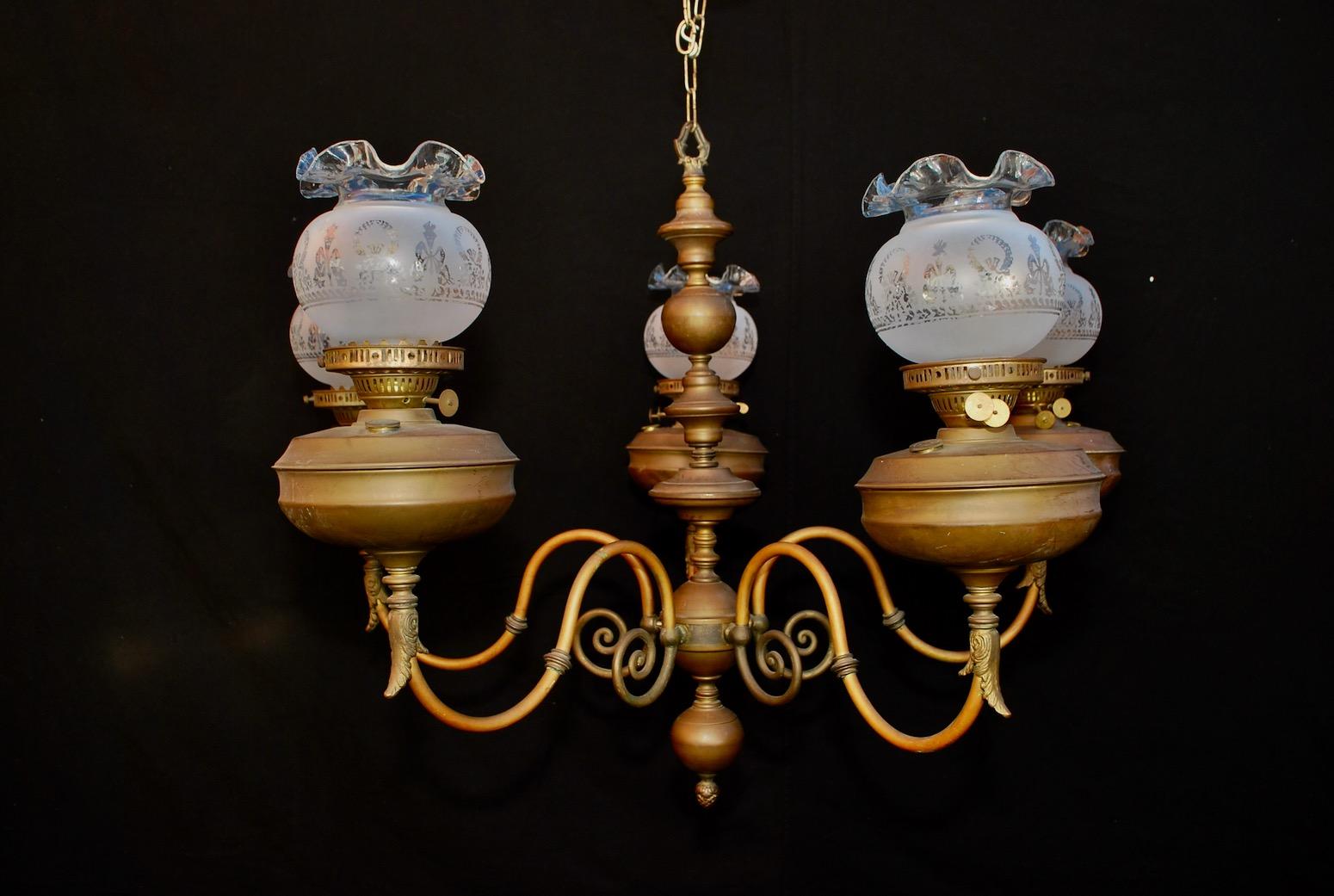 We also have our own line of wrought iron reproduction sconces and chandeliers, or we could do your own design
A nice late 19th century brass chandelier, originally it was oil lamp that was converted to electricity
the patina is much nicer in