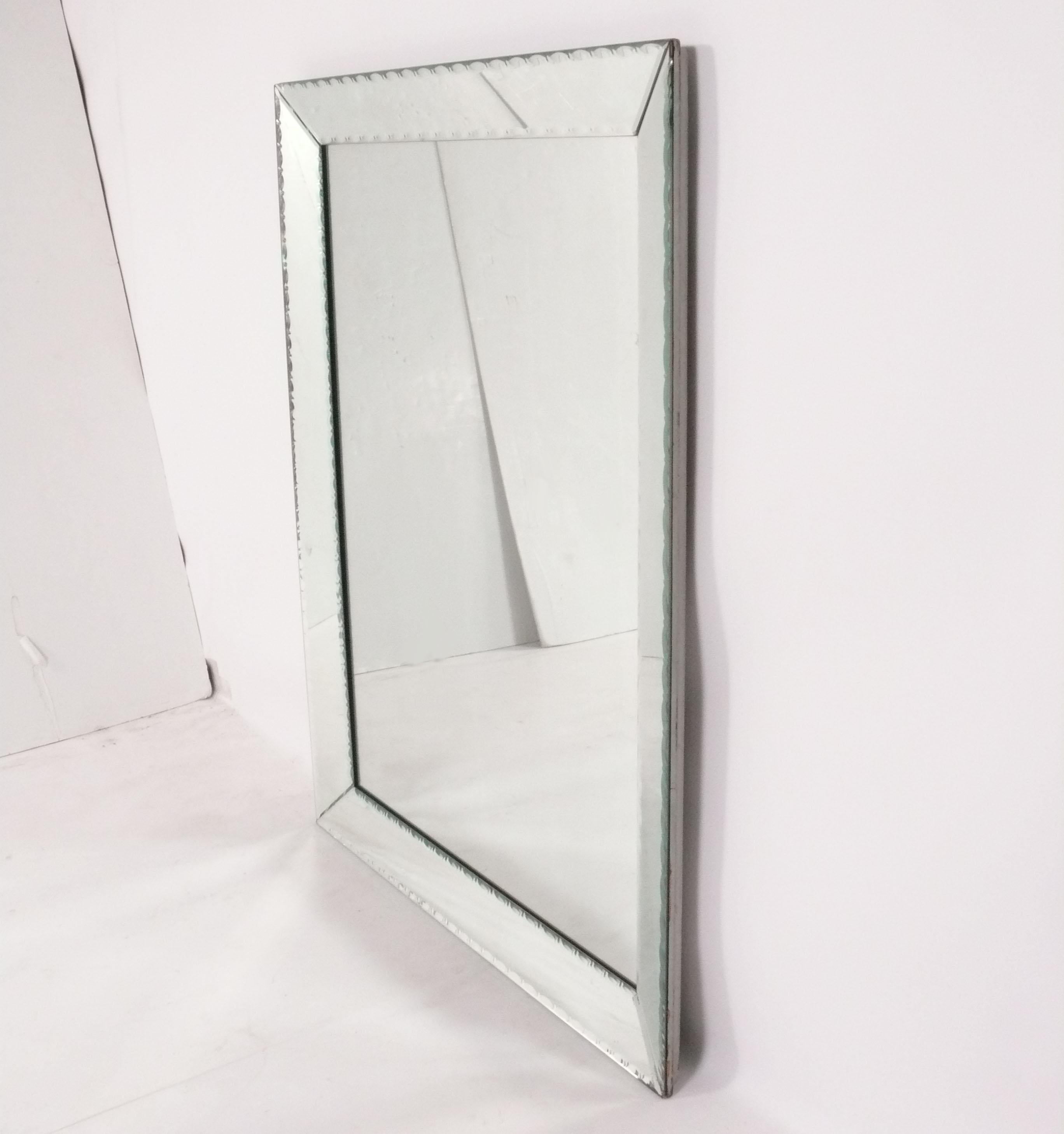 Elegant Large Scale Beveled Mirror, American, circa 1940s. It measures an impressive 54.25