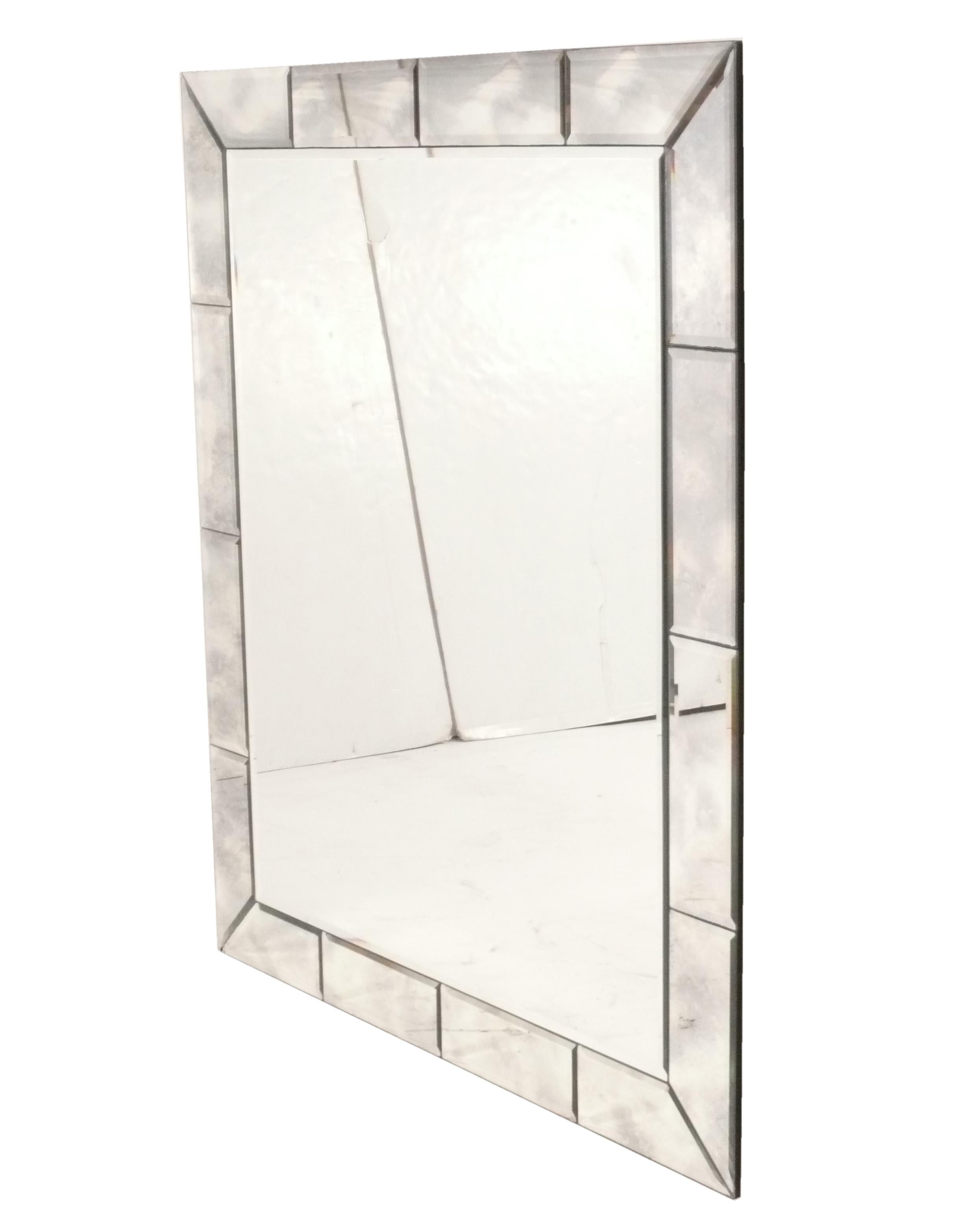 Elegant large scale mirror, American, circa 1940s. Simple, clean lined form with beveled border. 