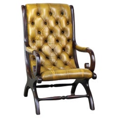 Elegant leather Chesterfield armchair combined with wood