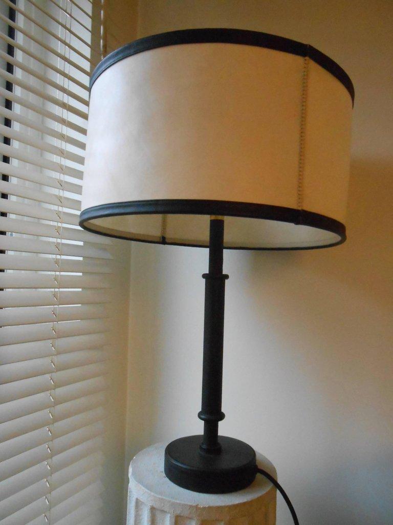 Fully covered with black leather (Hermès-France), parchment and leather lampshade. Two lights, mint condition. Designed by Jacques Adnet, circa 1950.
    
