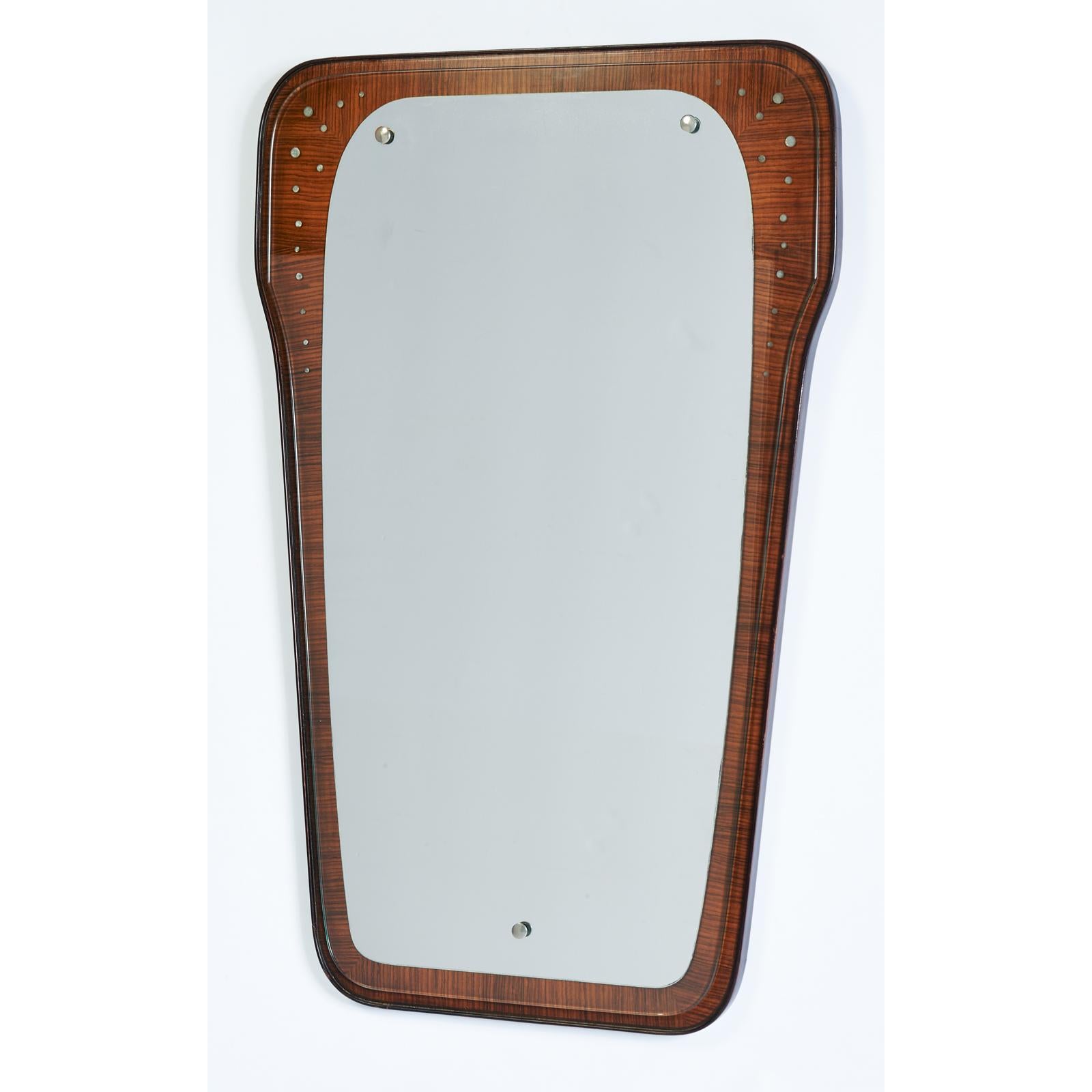 Italy, 1950s
Liberty style shaped mirror, beautifully grained wood frame with contrasting frame, partially mirrored glass with bubble decor, nickeled mounts
Dimensions: 35 H x 23 W.
 