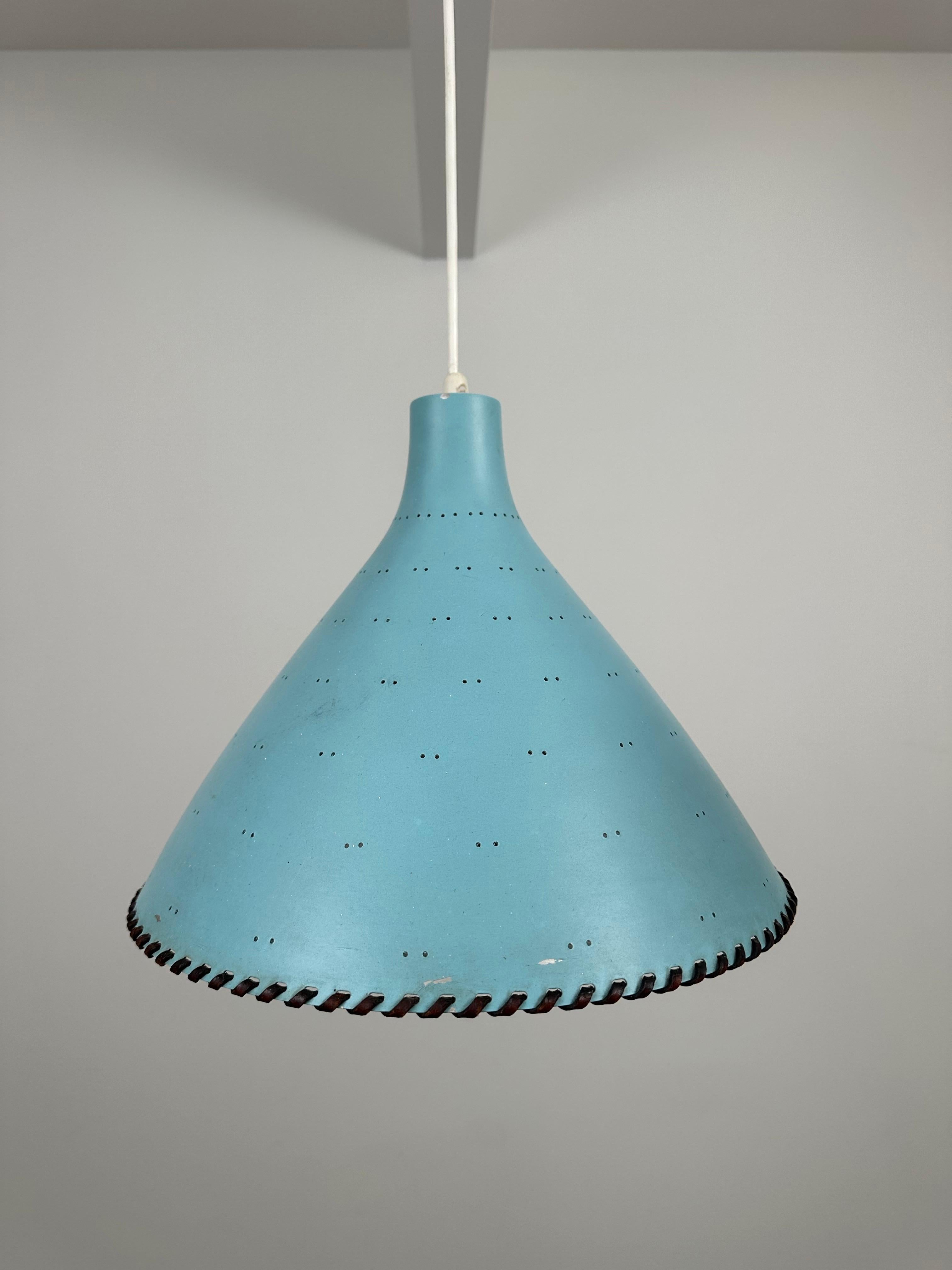 Experience the timeless elegance of the Paavo Tynell rare 1940's ceiling lamp, exclusively made to order by Taito Oy, Finland. This exquisite piece showcases intricate leather and brass details.  As a special order, this lamp reflects craftsmanship