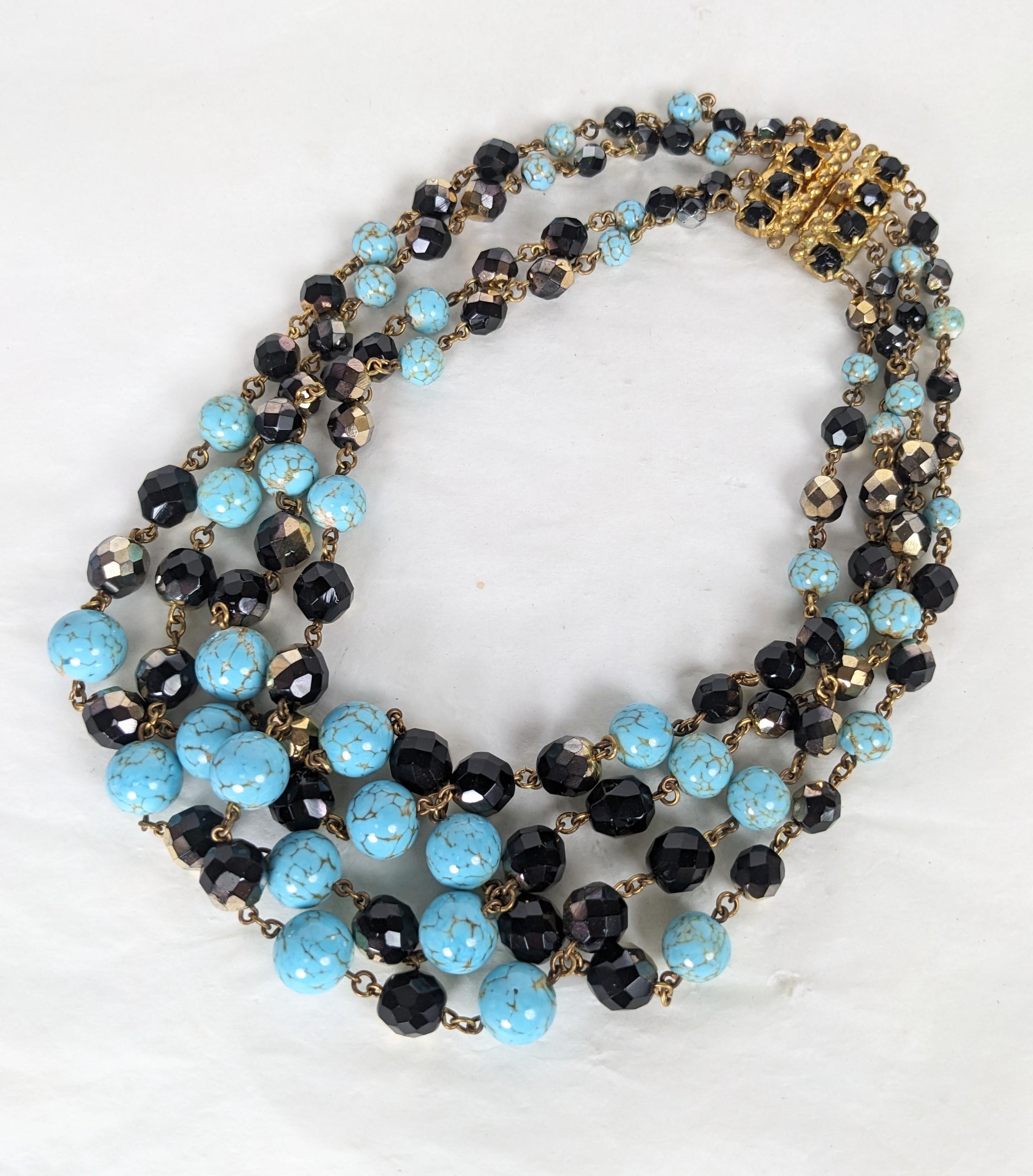 Rare Louis Rousselet glamorous Multi strand necklace. Composed of four strands of graduated beads of silver flashed jet and pate de verre faux matrix turquoise beads. Barbaric clasp set with black flashed jet stones. Art Deco period, hand made.