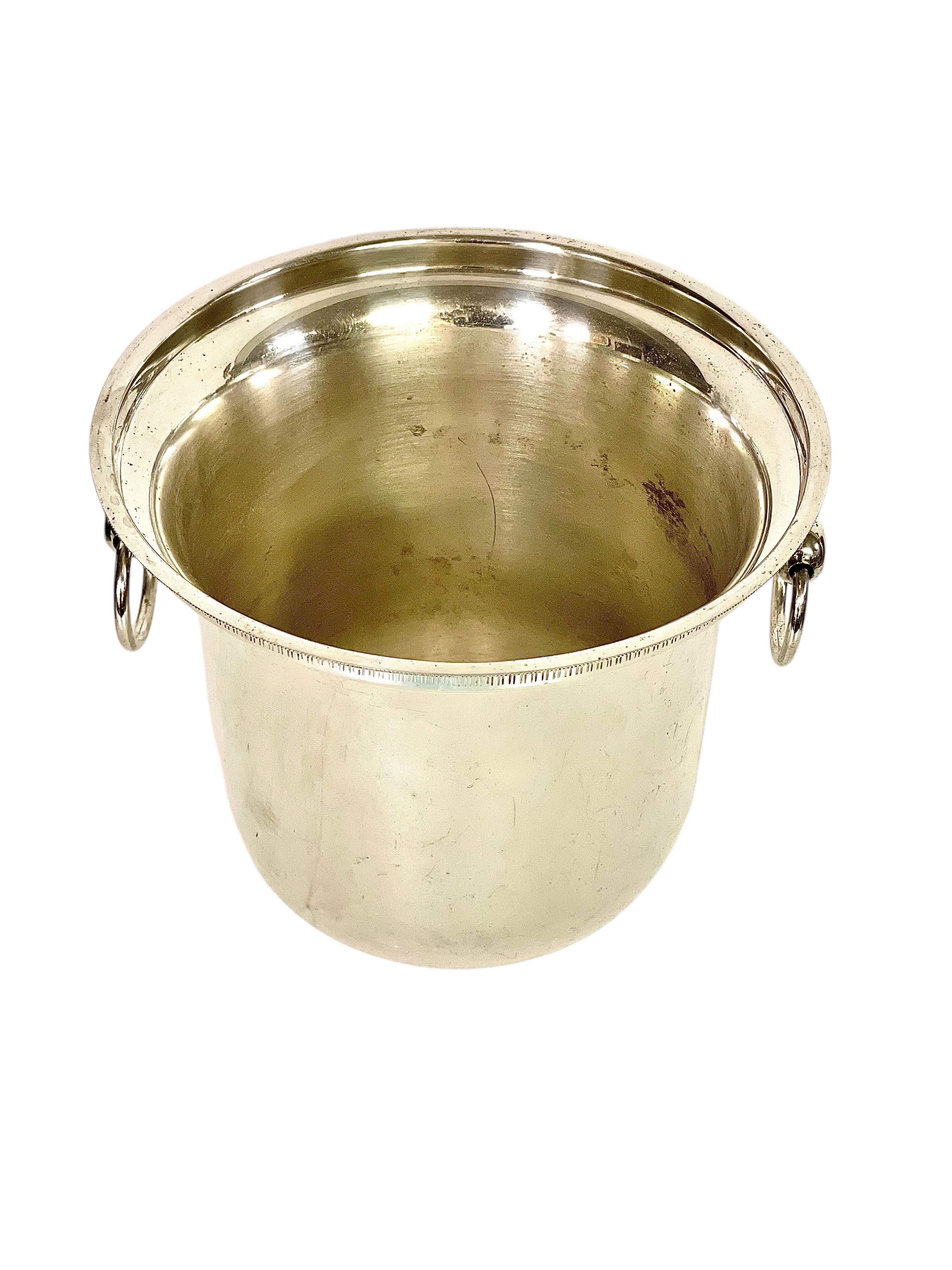 This elegant French champagne cooler, dating from the late 19th century, embodies the timeless sophistication of the Louis XVI style. Its neoclassical design and refined craftsmanship make it an exquisite addition to any festive occasion or