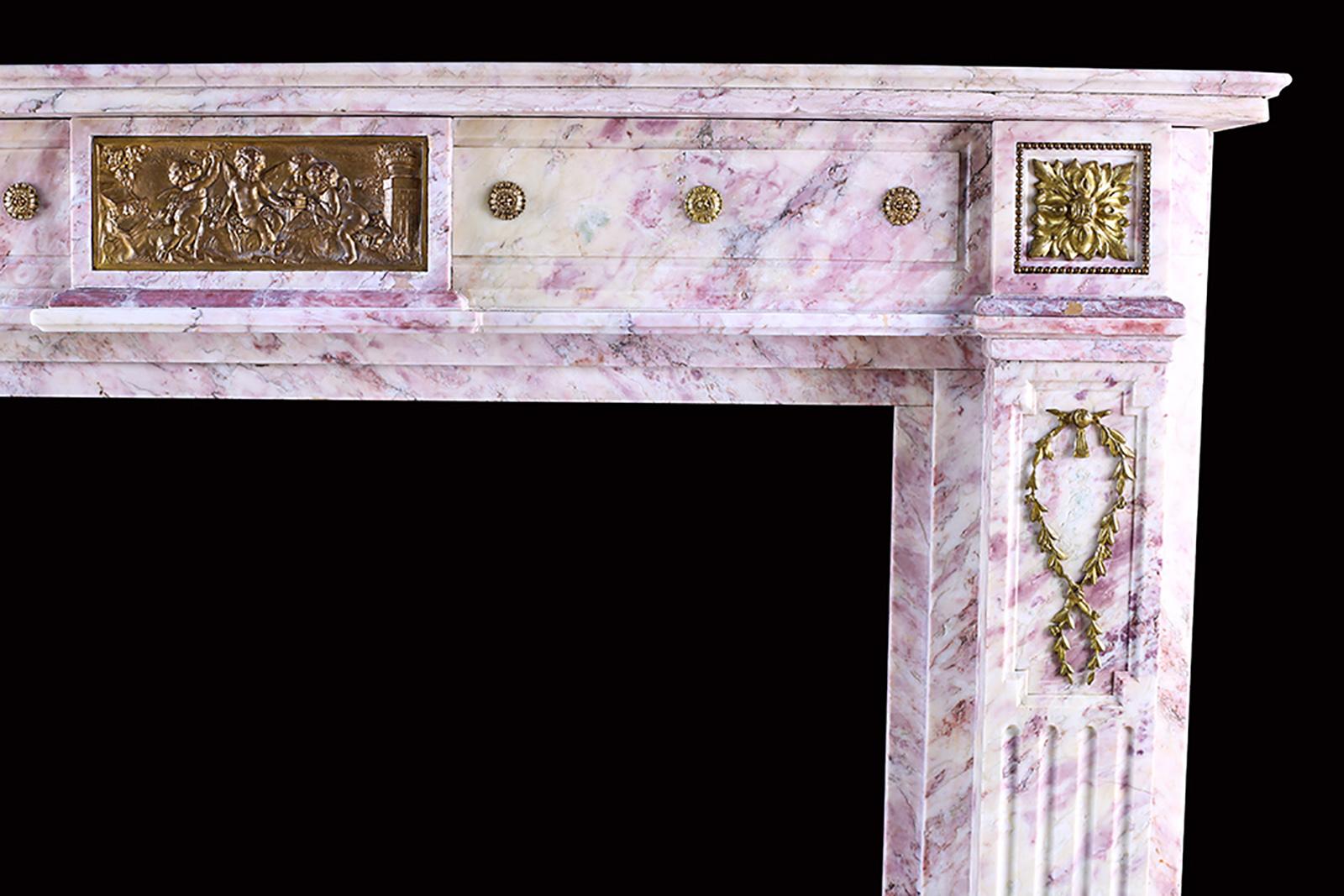 An Elegant Louis Xvi Style Fireplace Surround, Finely Carved In White And Pink Marble, Adorned With Scrolling Foliate And Floral Ormolu Decoration. French, Mid 19th Century.