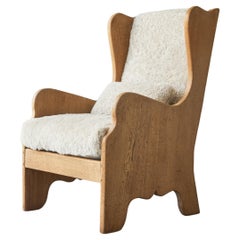 Antique Elegant Lounge Chair in Oak and Sheepskin in the Style of Axel Einar Hjorth 1920