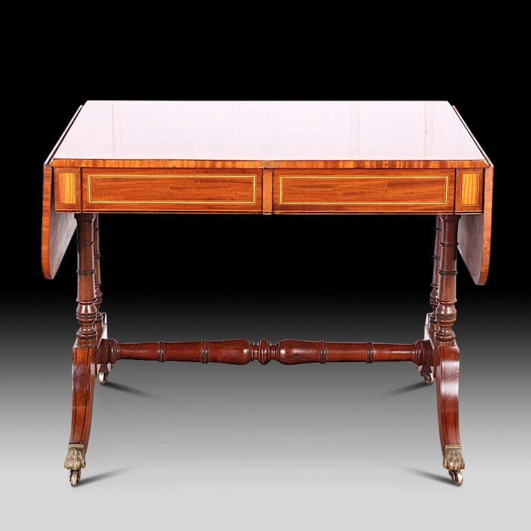 Inlaid and banded mahogany drop leaf sofa table restored to a high french polish. Gorgeous and small scaled for any room. 19th Century. The table at its smallest width is 36 inches wide, Each leaf is 11 inches wide. For a total expanded width of 58