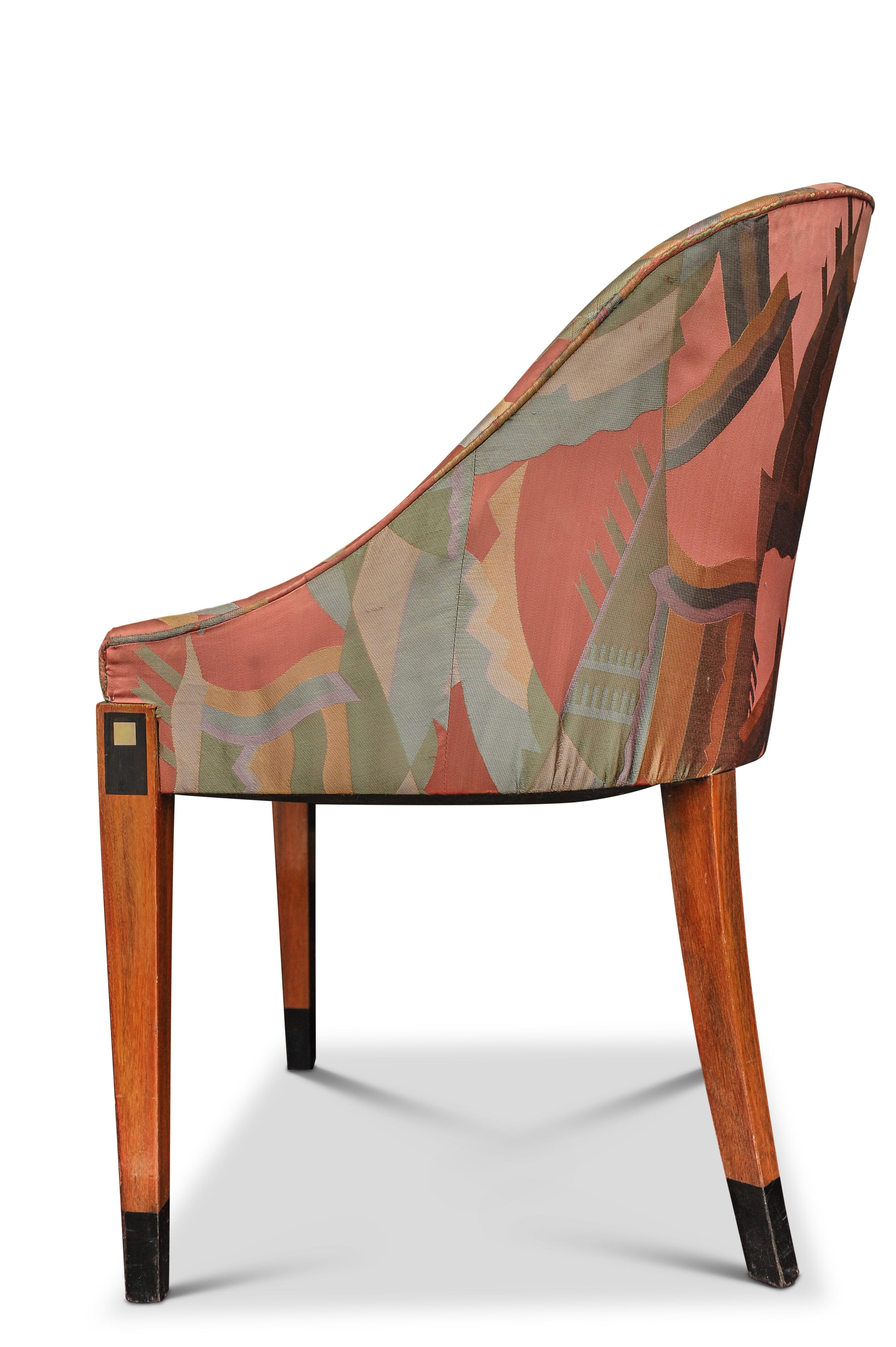An Elegant  Pair of French Art Deco tub chairs, raised on square tapered legs with ebonised and ivorine inlay with original upholstery.

In the style of Sue et Mare.

The spirit of collaboration was alive in the age of Art Deco. No duo quite