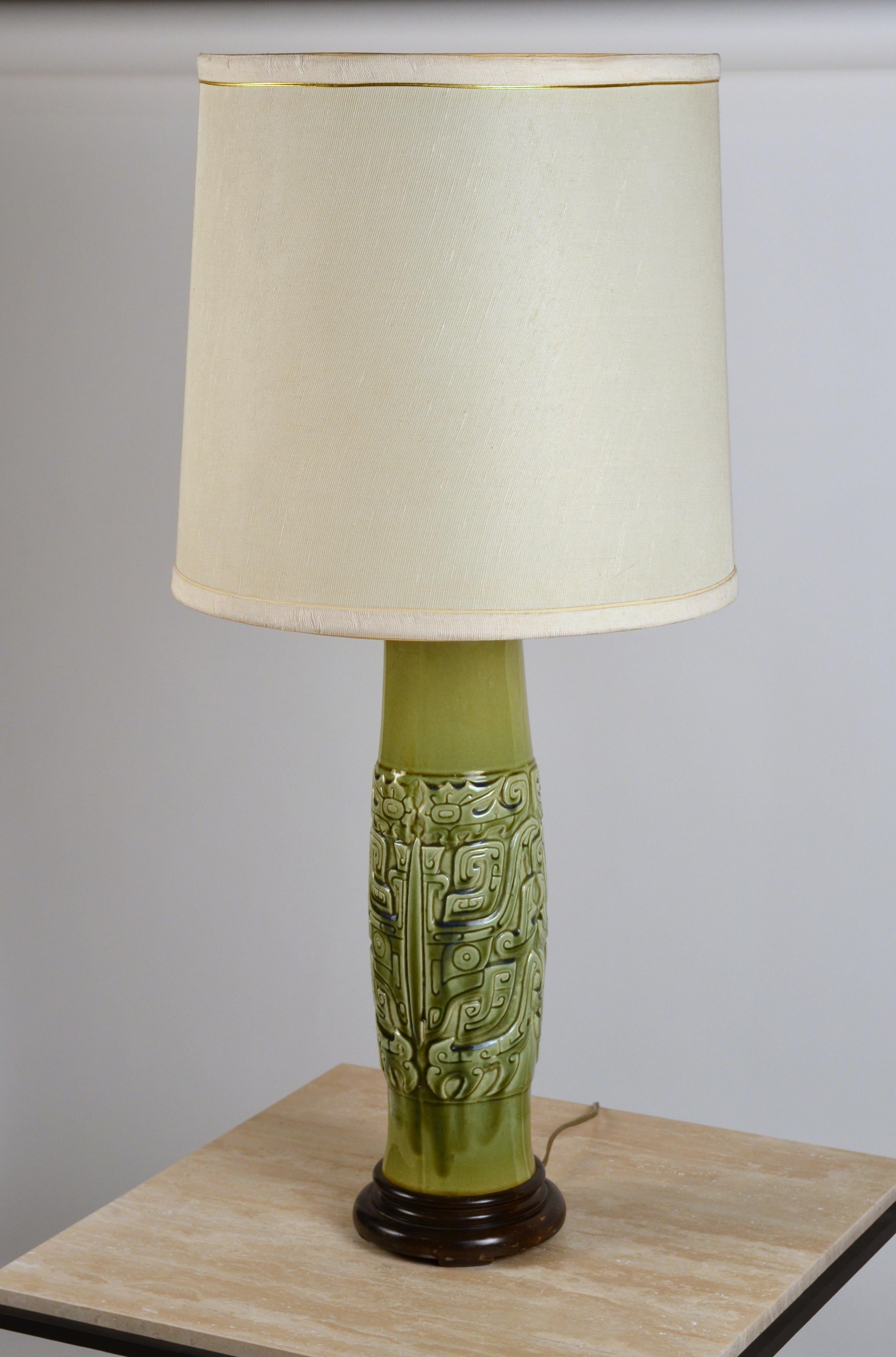 Elegant Mayan inspired ceramic lamp with original shade.

Overall lamp dimensions (listed): 33 in. tall x 16 in. diameter.

The body (to the final) is 33 in. tall x 6 in. diameter.

The shade is 14 in. diameter at top x 16 in. diameter at