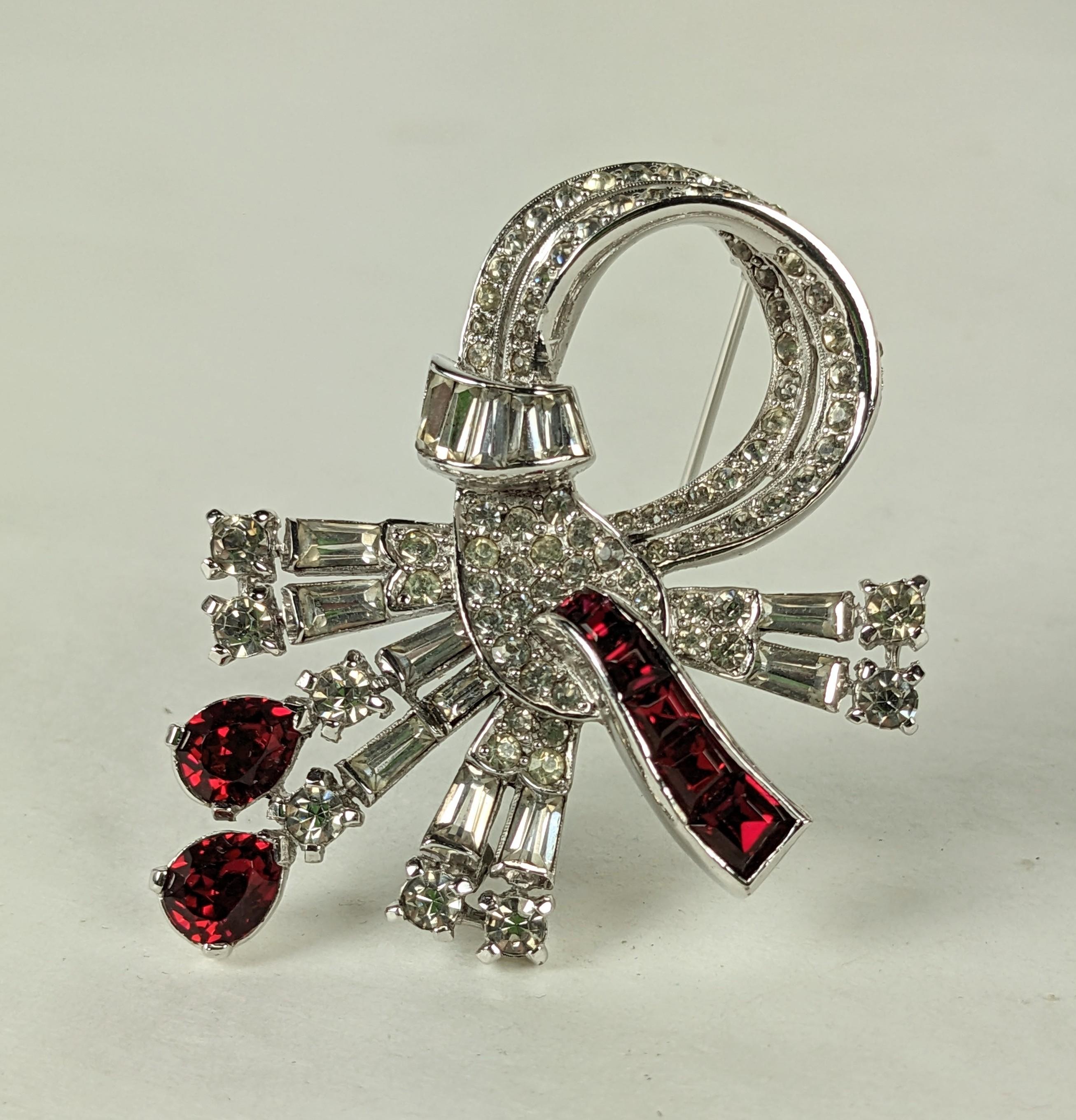 Elegant Mazer Ruby and Pave Spray from the 1950's. Swirl with pave and graduated baguette work in crystal and ruby. 2.25