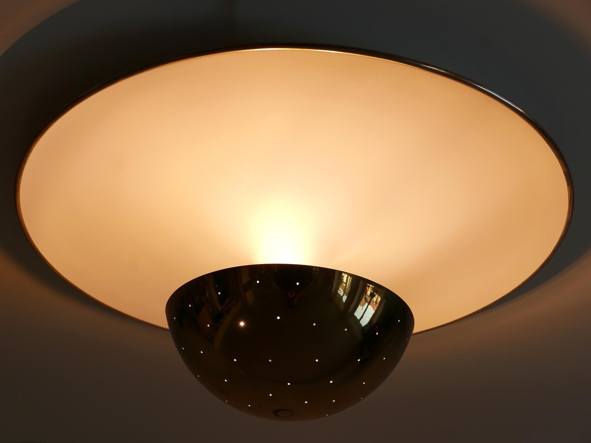 Extremely rare, large and elegant Mid-Century Modern flush mount or sconce in style of Gino Sarfatti Model #155. With perforated brass diffusor. This is a very impressive and decorative piece of German design. Designed 1954 and manufactured by Bünte