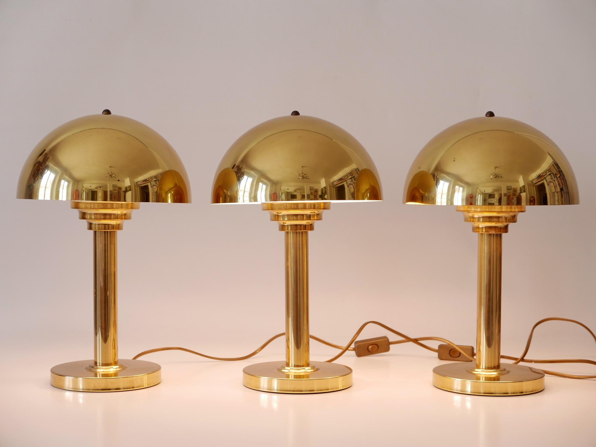 Elegant and highly decorative Mid-Century Modern brass table lamps. Designed and manufactured by WSB, Germany, 1960s.

Three identical lamps are available. Price per item.

Executed in polished brass sheet and tube, each lamp comes with 1 x E27