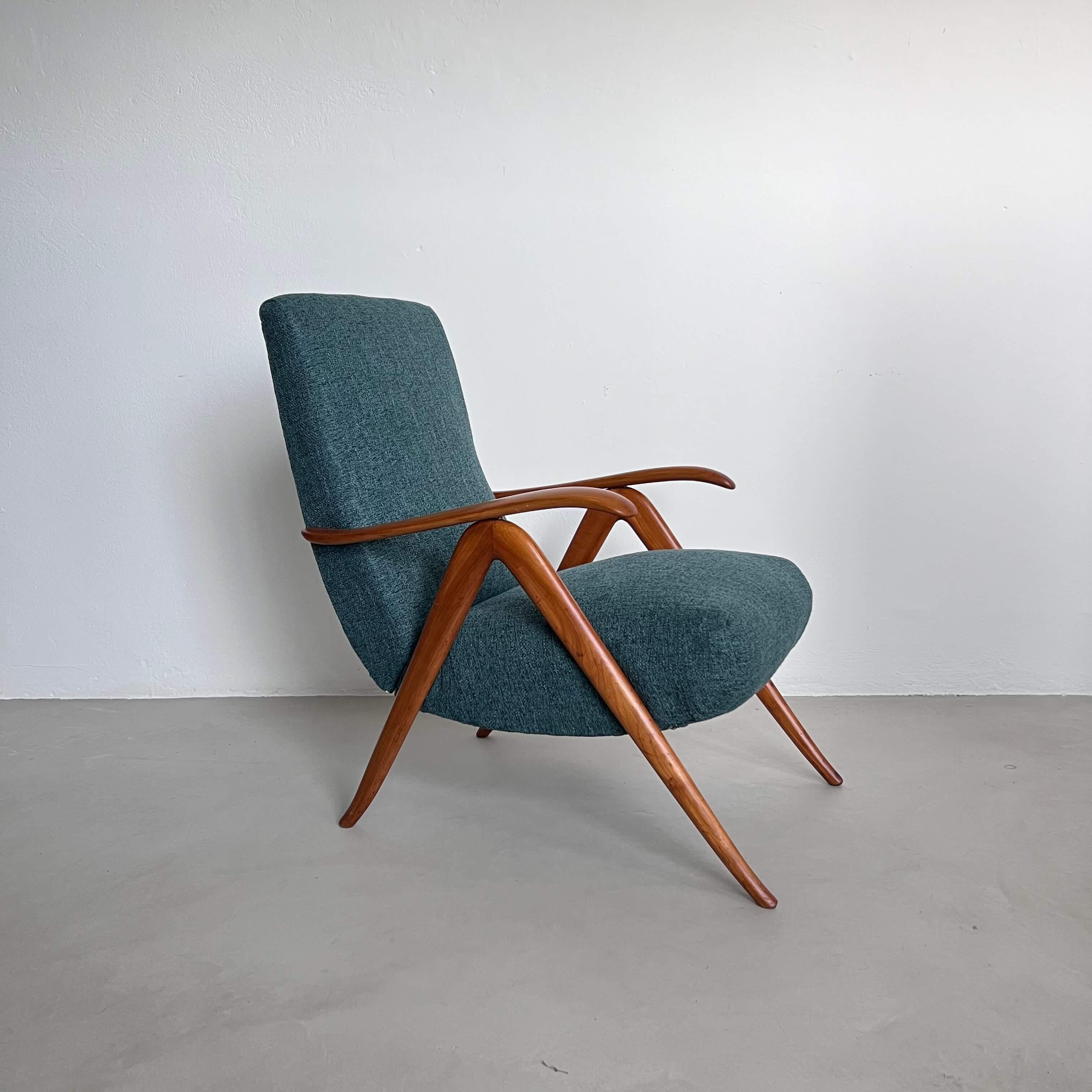 Two vintage Italian armchairs, Mid-Century Modern 1960’s , with wooden frame and petrol green fabric upholstery. They are unsigned and unlabeled but have nods to the style of Guglielmo Ullrich. Most likely made in Italy, they are nicely crafted,