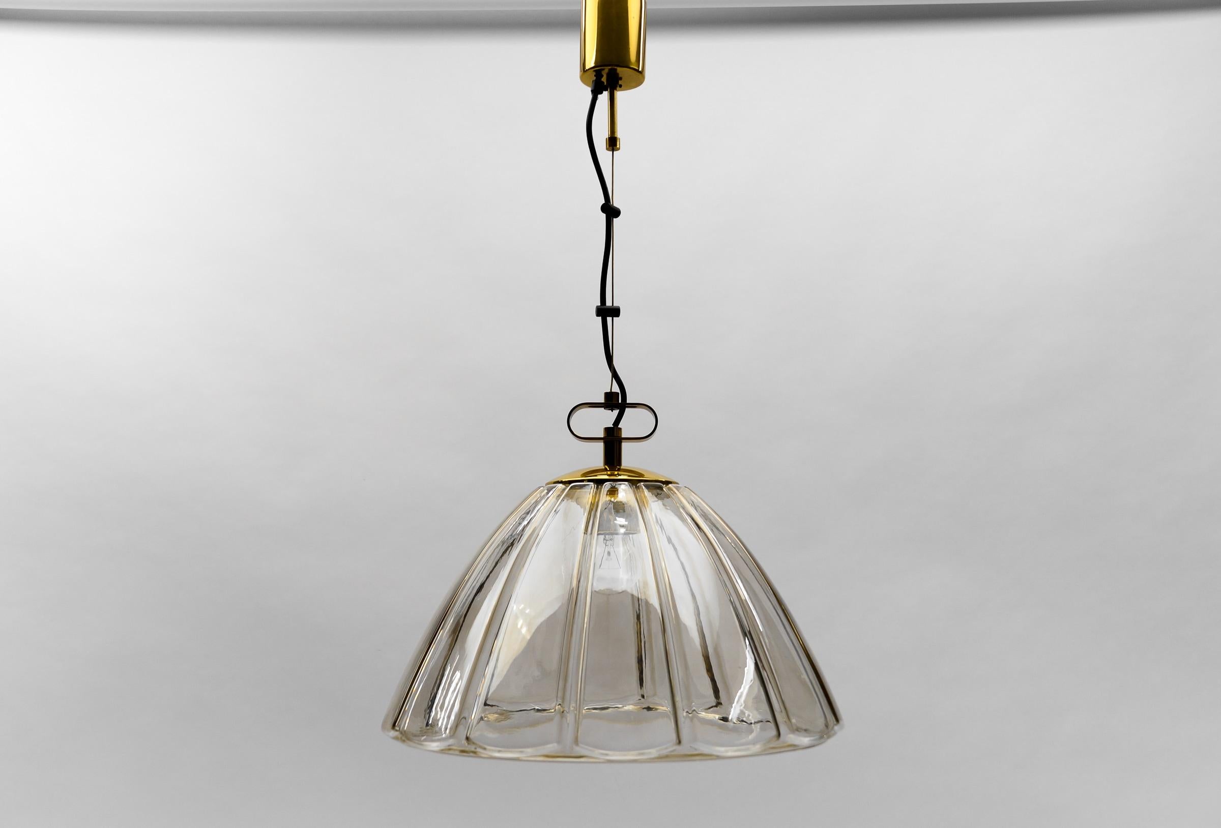 Elegant Mid-Century Modern Smoked Glass Pendant Lamp by Limburg, 1960s Germany

Dimensions
Diameter: 17.71 in. (45 cm)
Height: 29.52 in. (75 cm)

One E27 socket. Works with 220V and 110V.

Our lamps are checked, cleaned and are suitable for use in