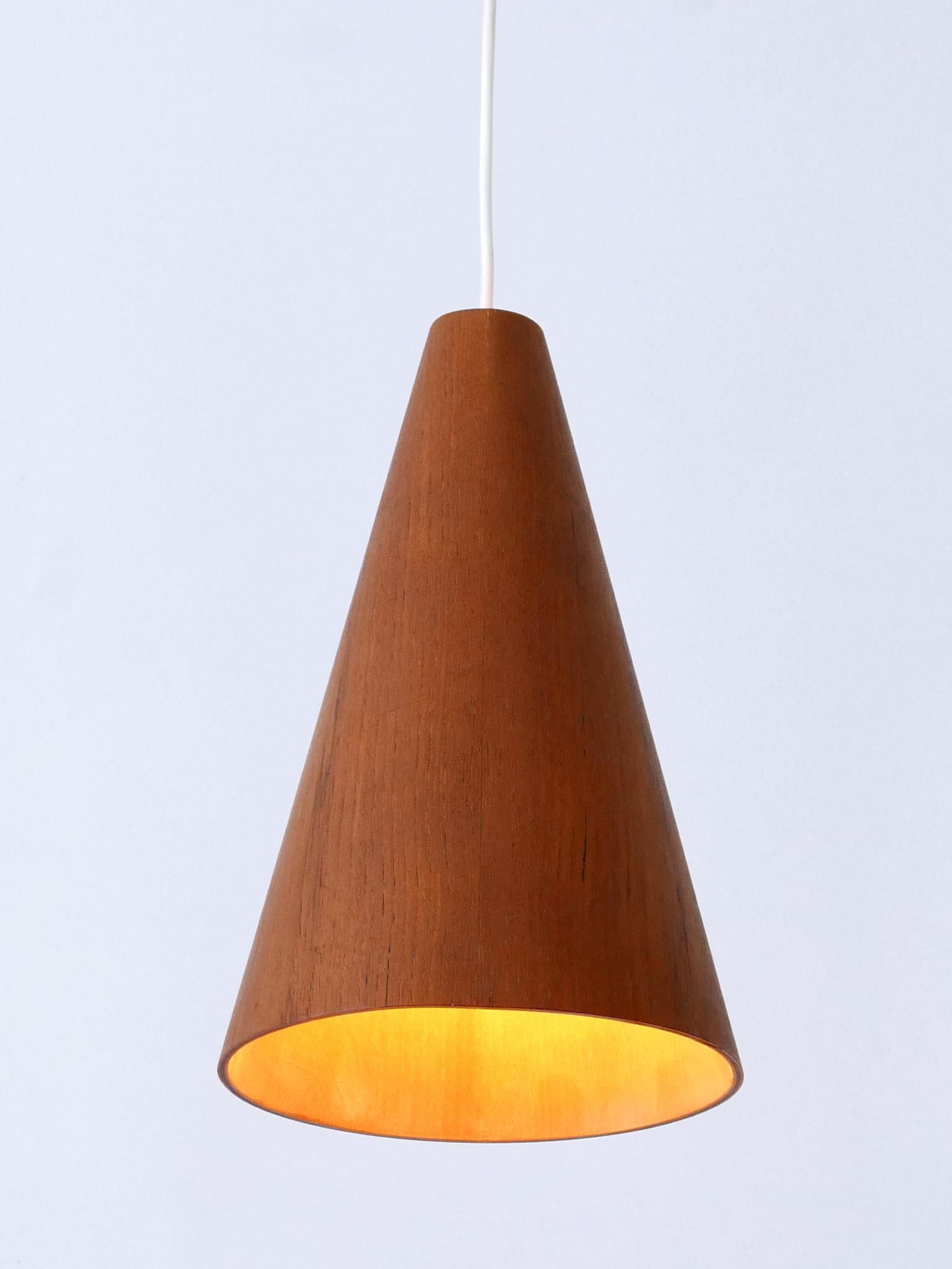 Rare and elegant Mid-Century Modern teak wood pendant lamp or hanging light. Designed & manufactured in Scandinavia, 1960s.

Executed in teak wood, the lamp comes with 1 x E27 / E26 Edison screw fit bulb socket, is wired and in working condition. It
