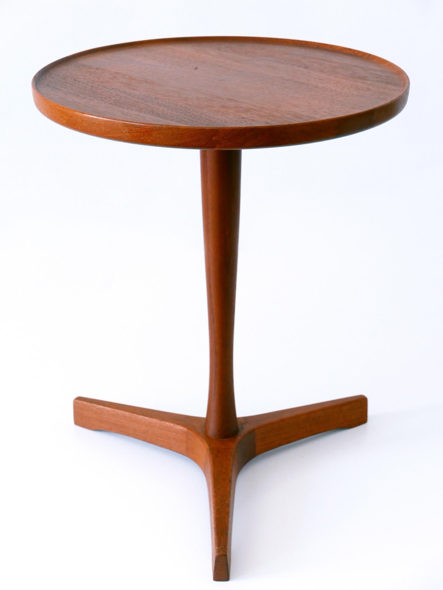 Rare and elegant Mid-Century Modern occasional side table. 
Designed by Hans C. Andersen and manufactured by Artek, Denmark, 1960s.
Marked beneath the plate: Made in Denmark by Artek.

Executed in teak wood.

Dimensions: 
H 17.72 in (45 cm)
Dm 14.18