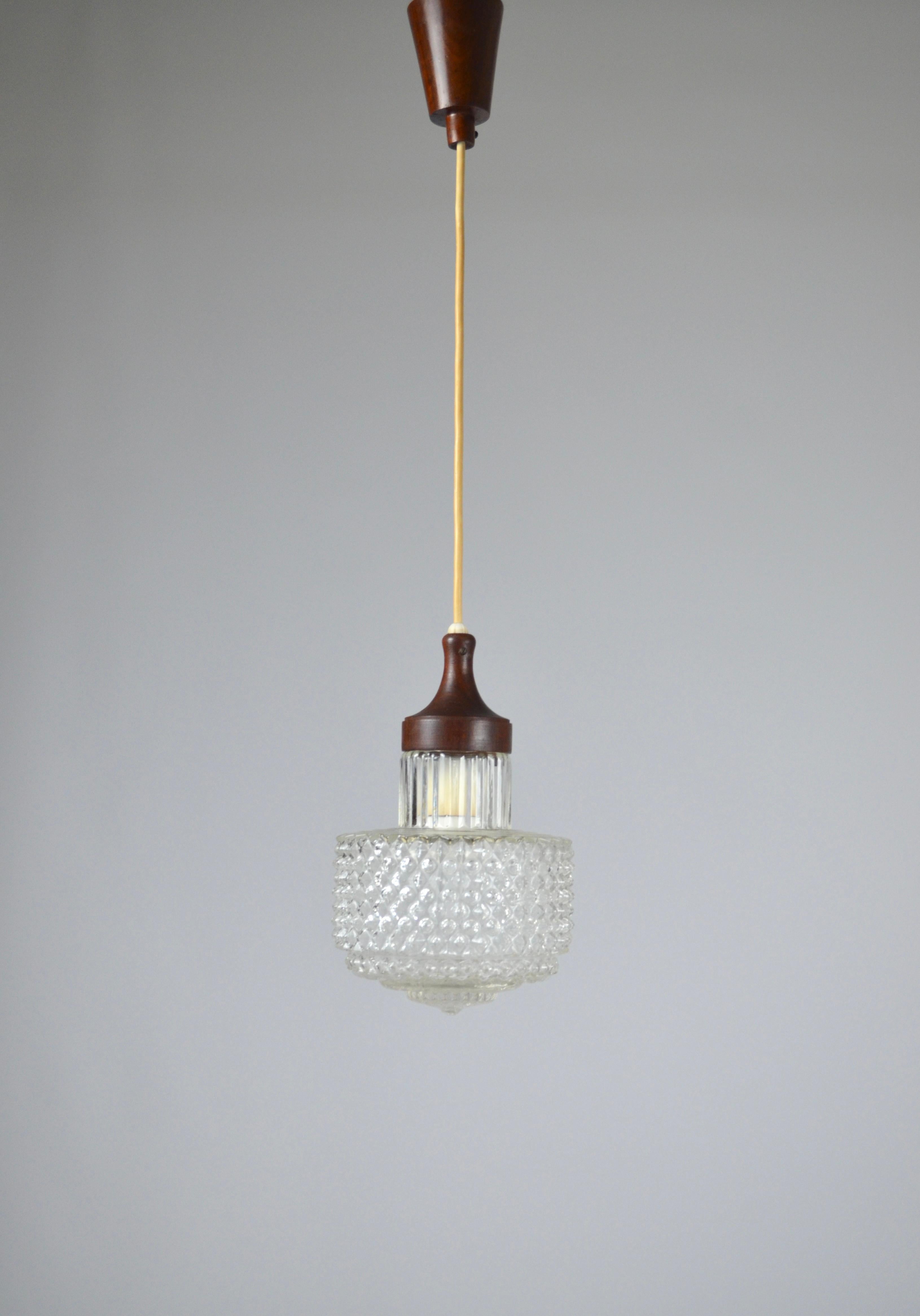 Elegant scandinavian pendant lamp, 1950s
Very beautiful glass globe and nice finish with its wooden elements