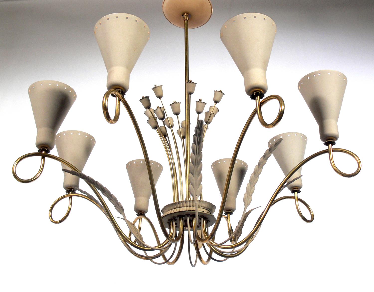 Elegant midcentury chandelier in the manner of Paavo Tynell, circa 1950s. Retains it's original greige color enameled shades and original warm patina to the brass.