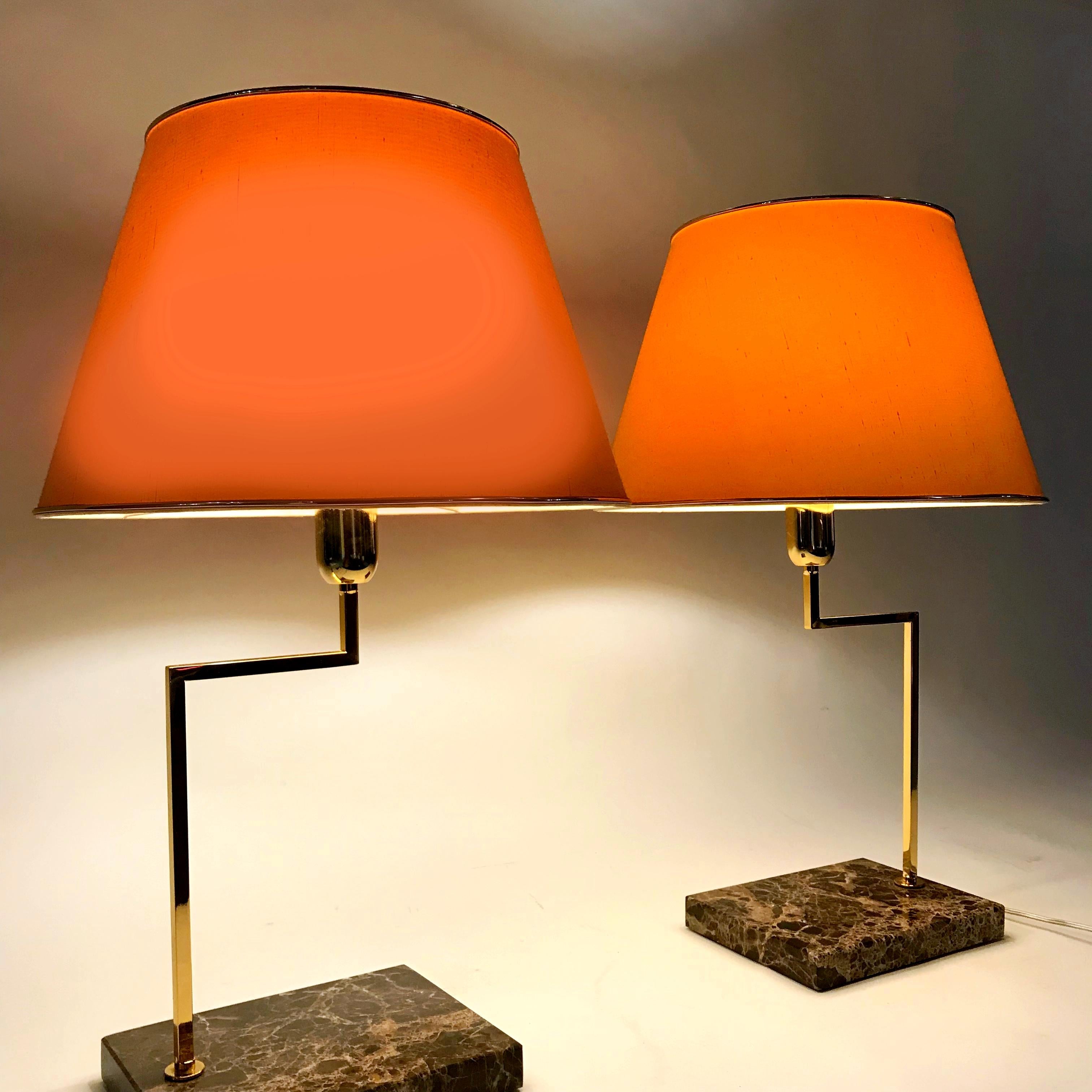 Pair of Italian midcentury large marble based table lamps with gilt brass arms.
The shades provide a large-area light. Newly rewired and tested condition.