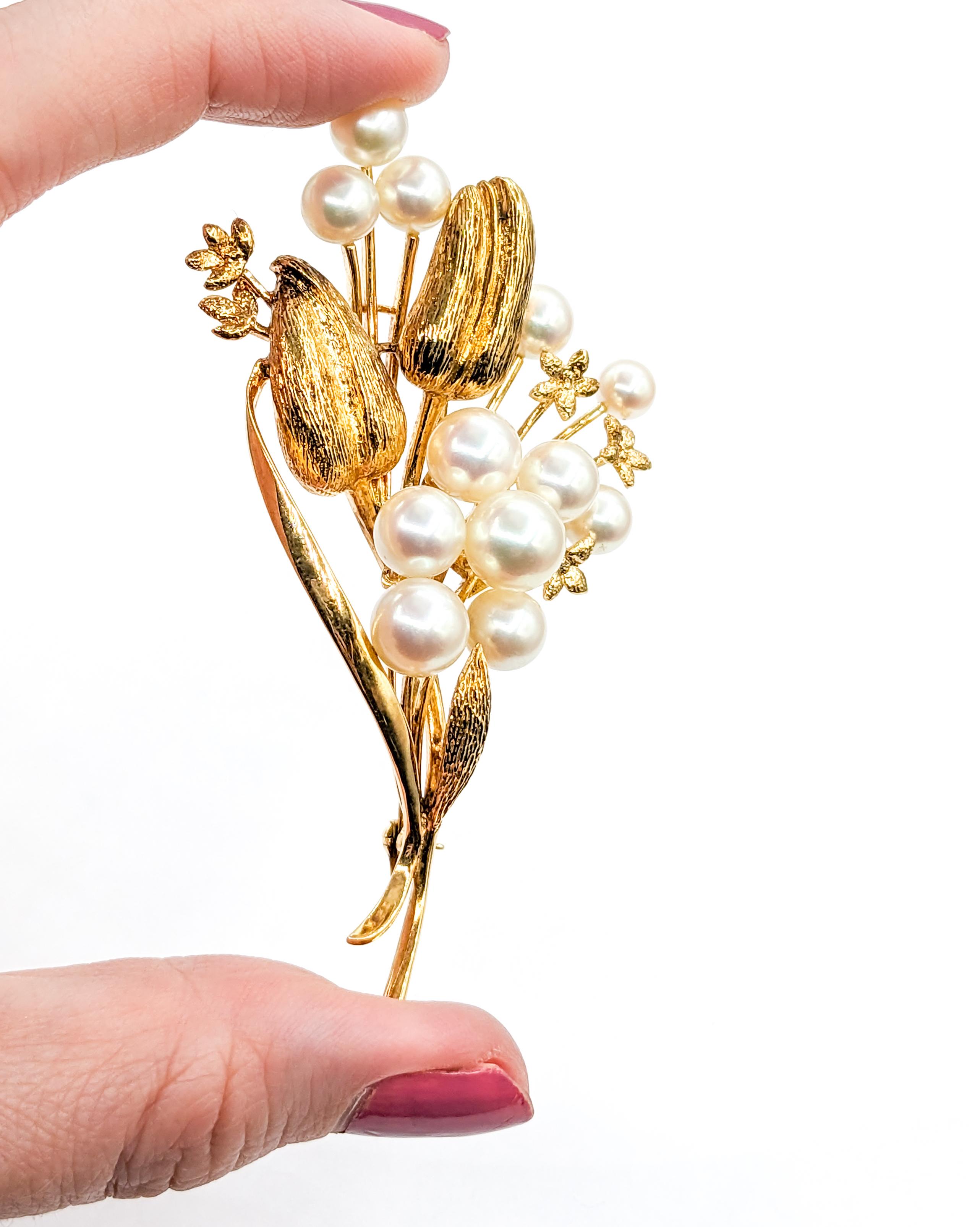 Elegant Mikimoto Brooch Adorned with Akoya Pearls

Experience the allure of timeless elegance with this beautiful Mikimoto brooch, masterfully crafted in the warm glow of 14ky yellow gold. This piece showcases an array of lustrous 5.5-8.6mm Akoya