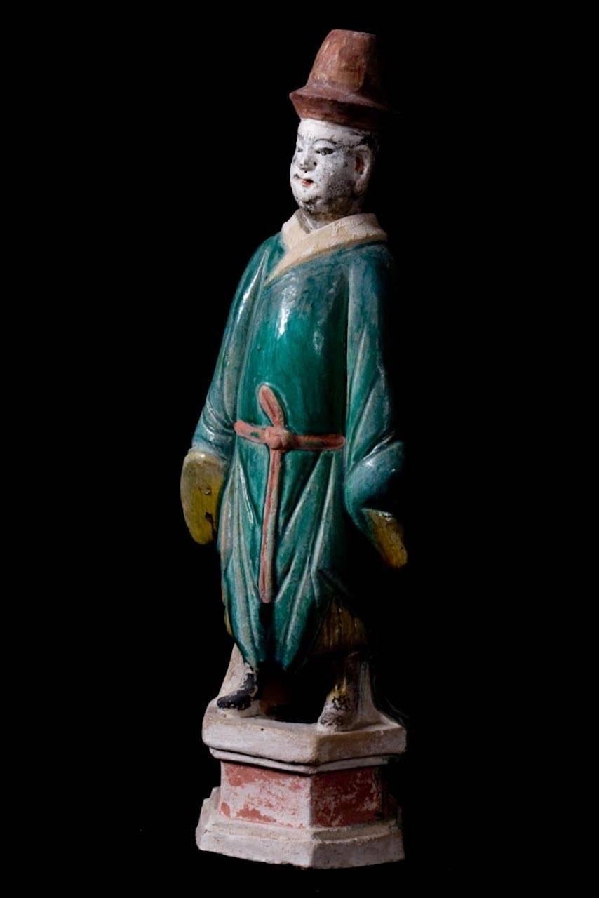 A fine example of a court attendant as in the Forbidden City of Beijing, elegantly dressed in a Green Daopao – a traditional men’s formal attire from the Ming Dynasty dated 1368-1643 A.D. – with glazed robes and Red Pigment remains in his hat and