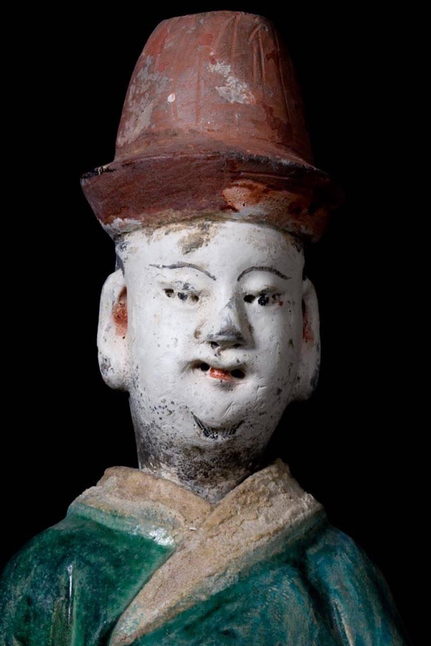 A fine example of a court attendant as in the Forbidden City of Beijing, elegantly dressed in a Green Daopao – a traditional men’s formal attire from the Ming Dynasty dated 1368-1643 A.D. – with glazed robes and Red Pigment remains in his hat and