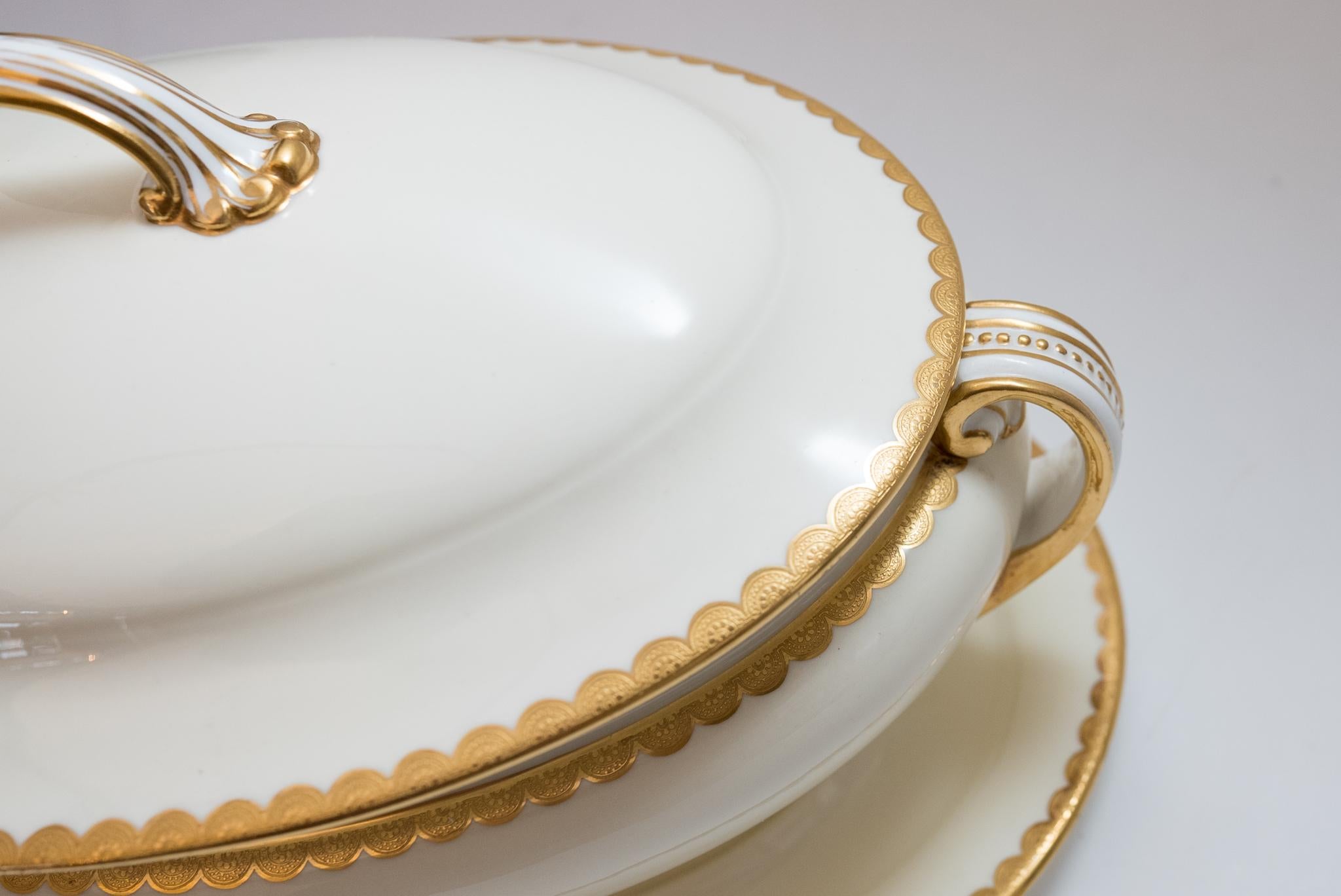 A wonderful serving piece from the re known porcelain firm of Minton, England. This 3 piece set includes the tureen, cover and fitted under plate or platter. Custom ordered through the fine Gilded Age retailer: Davis Collamore New York. It features