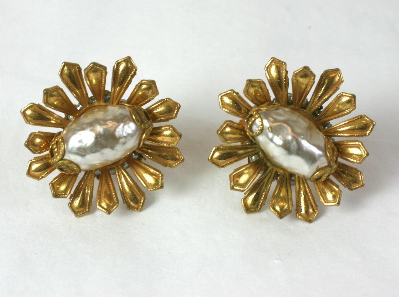 Dimensional Miriam Haskell Gilt Flower Earrings with signature faux baroque pearl. Clip back fittings with tiny seed pearl detail sewn around filigree base.  Signature Russian gilt finish. 1950's USA. Signed. 
1.25
