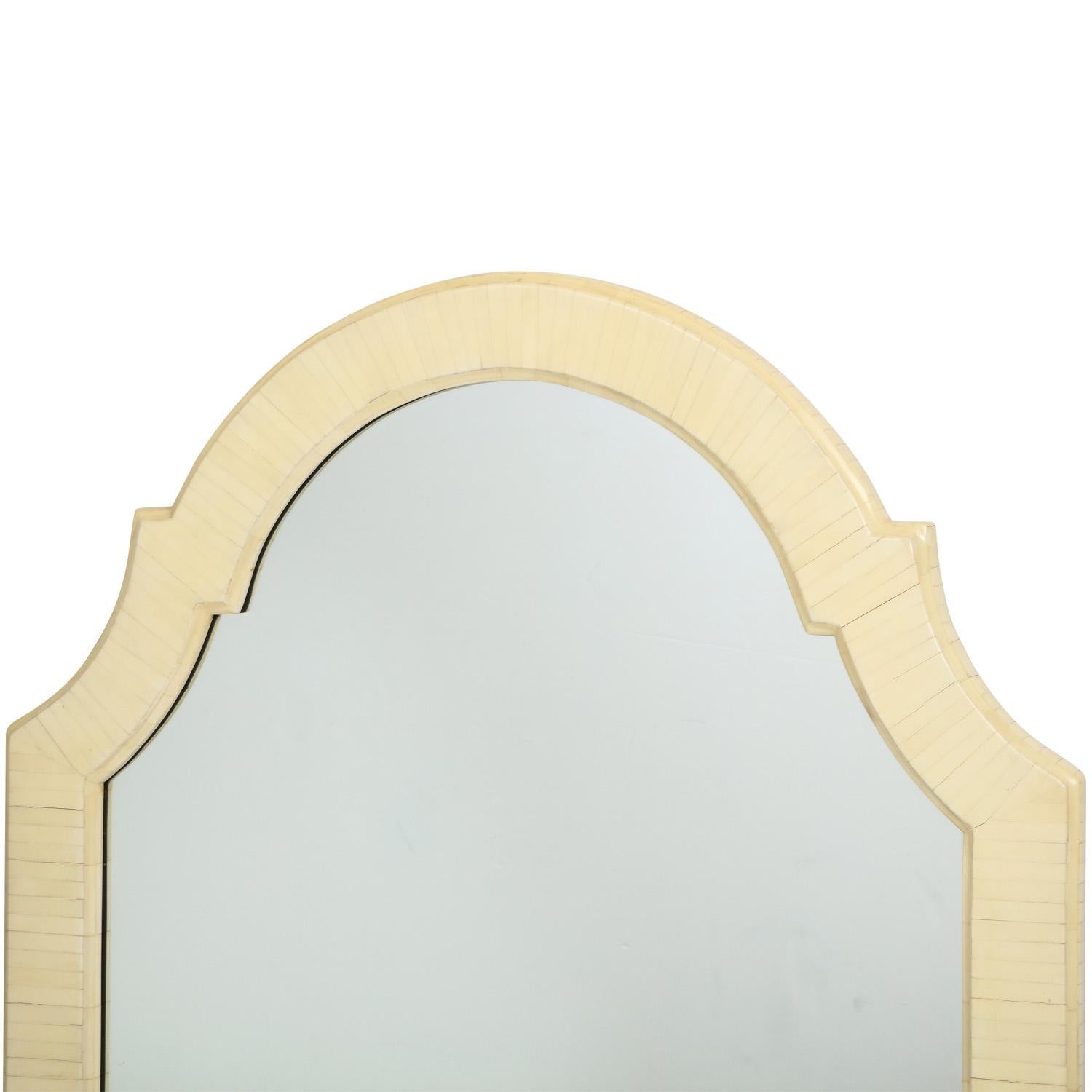 Elegant arc top mirror in tessellated bone by Enrique Garces, Columbia 1970's. The graceful form along with the luxurious material makes this mirror stand out.