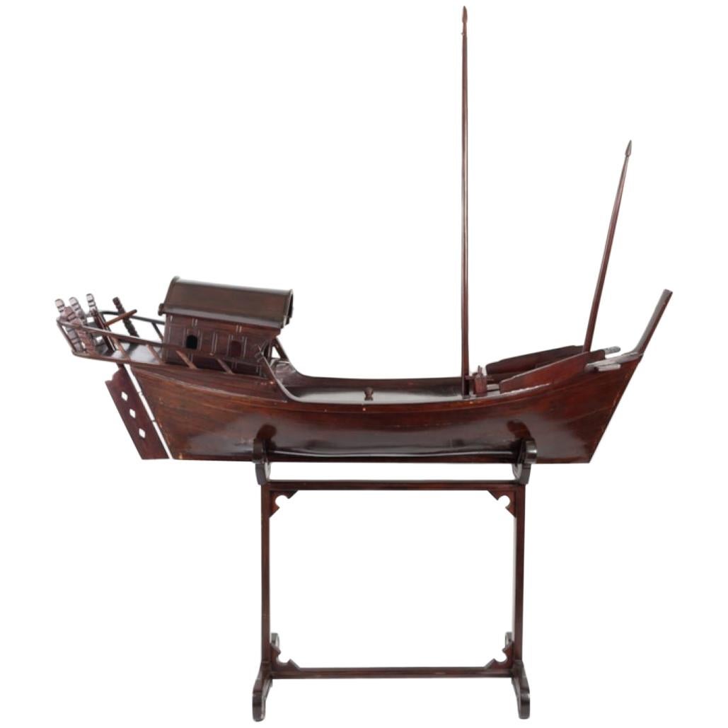 Elegant model of Chinese or Wietnamese Sailboat, exotic wood, probably bamboo, tainted in mahogany color with assorted stand, 20th century.
The 2 masts can be removed as well as the top cabin (for shipping)
The sails and rigging are missing
Good