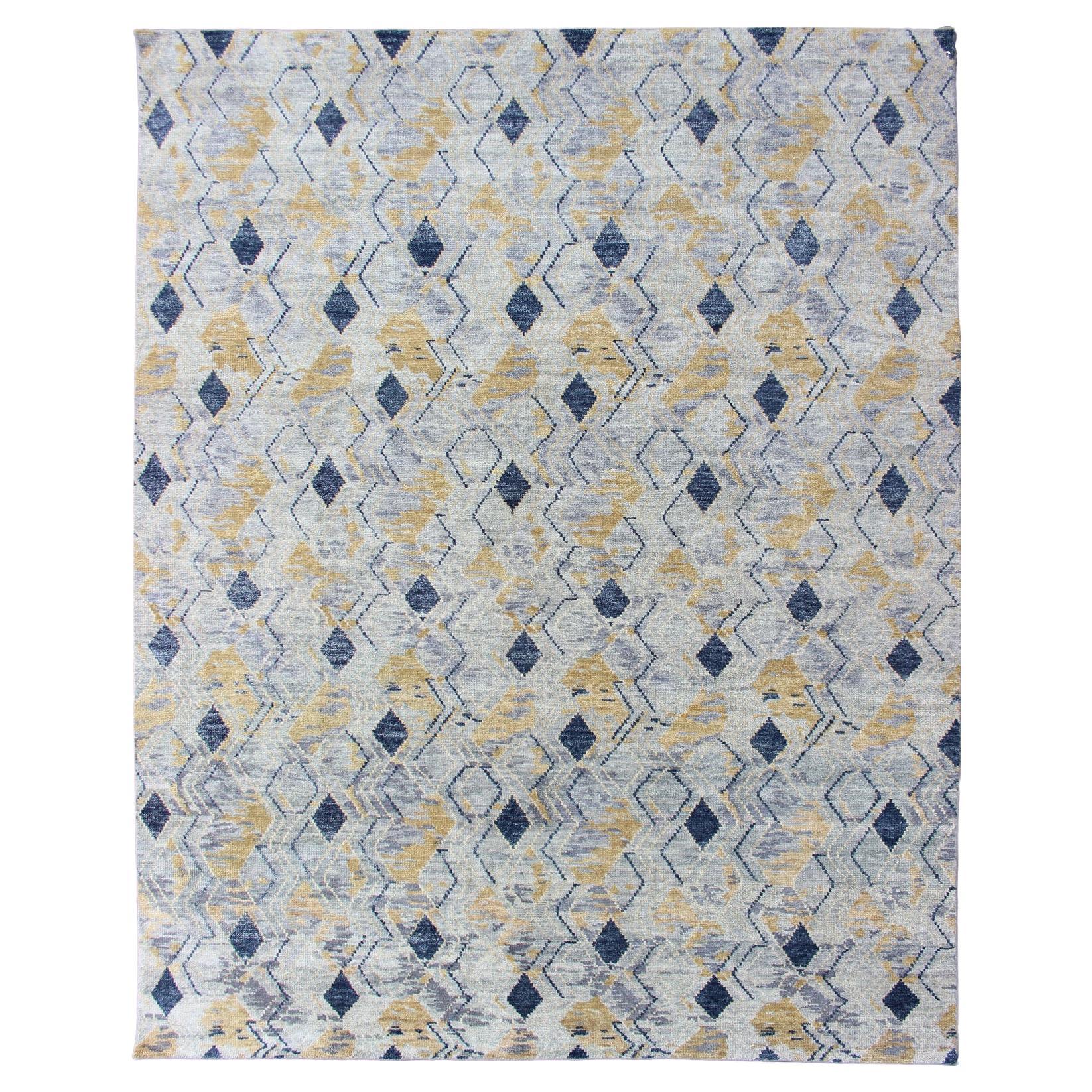 Eleganter moderner geometrischer Teppich in sanften Blau- und warmen Goldtönen