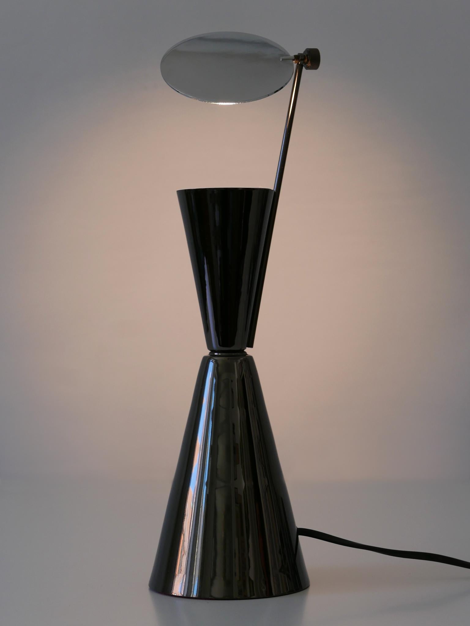 Rare and elegant Modernist diabolo table lamp with an adjustable, rotating metal reflector. Designed and manufactured in 1980s, Spain.

Executed in nickel-plated and gray metallic enameled metal, the lamp needs 1 x halogen bulb, is wired, and in