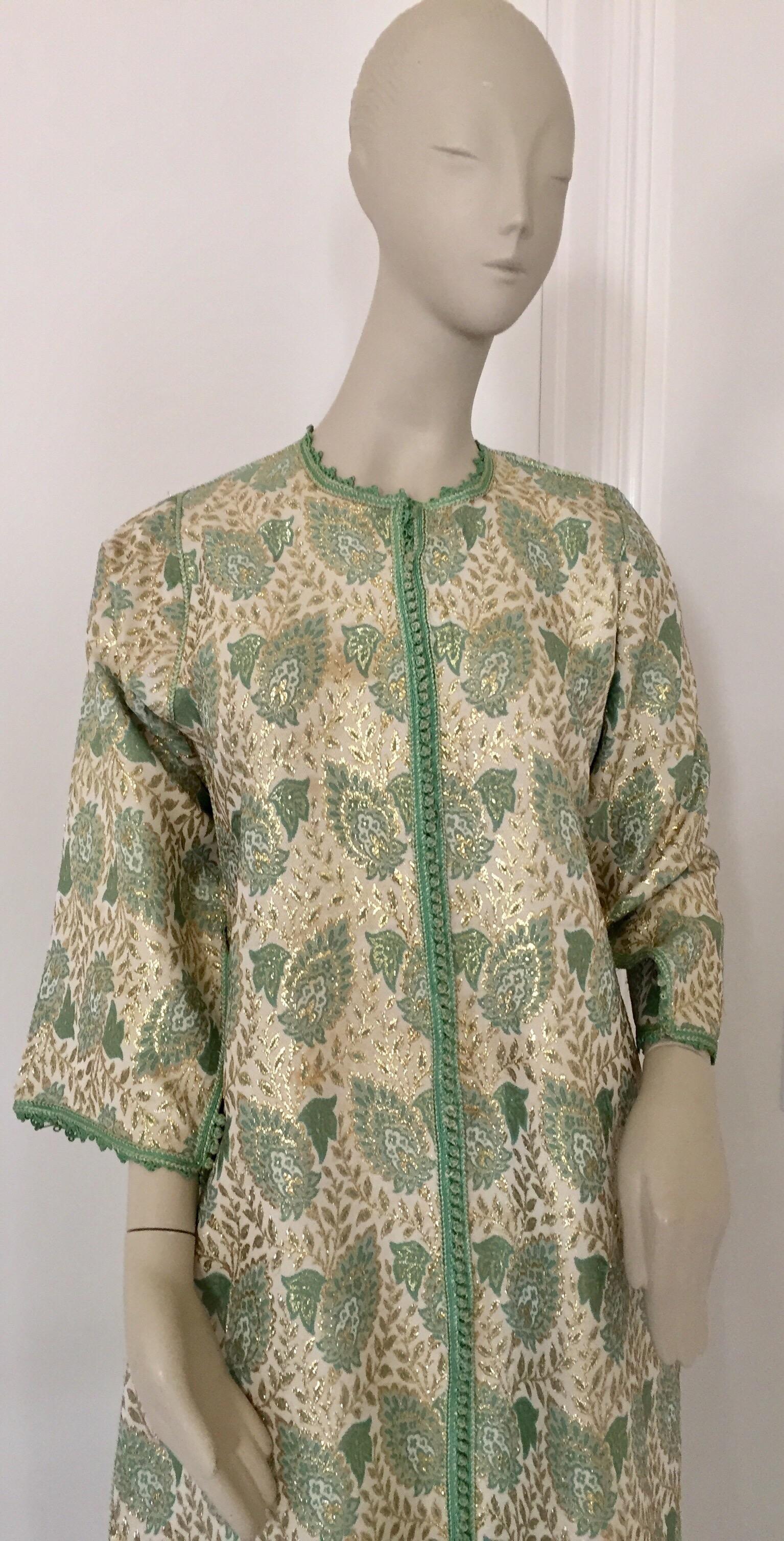 Elegant Moroccan caftan lime green and silver and gold lame metallic floral brocade,
circa 1970s.
It’s crafted in Morocco and tailored for a relaxed fit with wide sleeves
This long maxi dress kaftan is embroidered and embellished entirely by