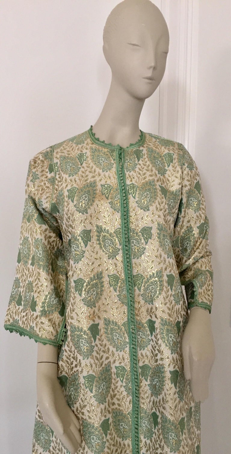 Elegant Moroccan caftan lime green and silver and gold lame metallic floral brocade,
circa 1970s.
It’s crafted in Morocco and tailored for a relaxed fit with wide sleeves
This long maxi dress kaftan is embroidered and embellished entirely by