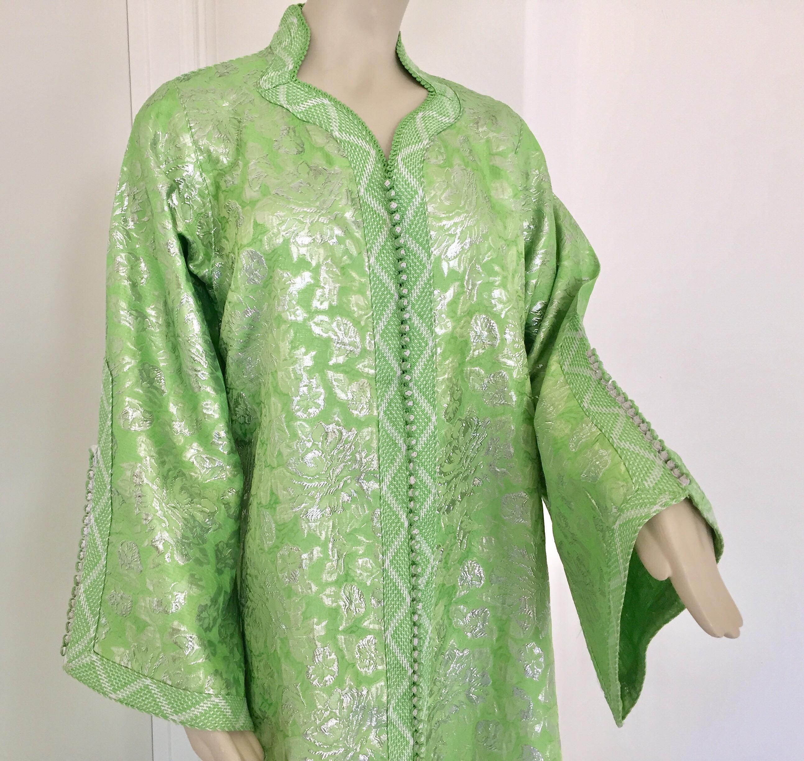 Elegant Moroccan caftan lime green and silver lame metallic floral brocade,
circa 1970s.
It’s crafted in Morocco and tailored for a relaxed fit with wide sleeves
This long maxi dress kaftan is embroidered and embellished entirely by hand with