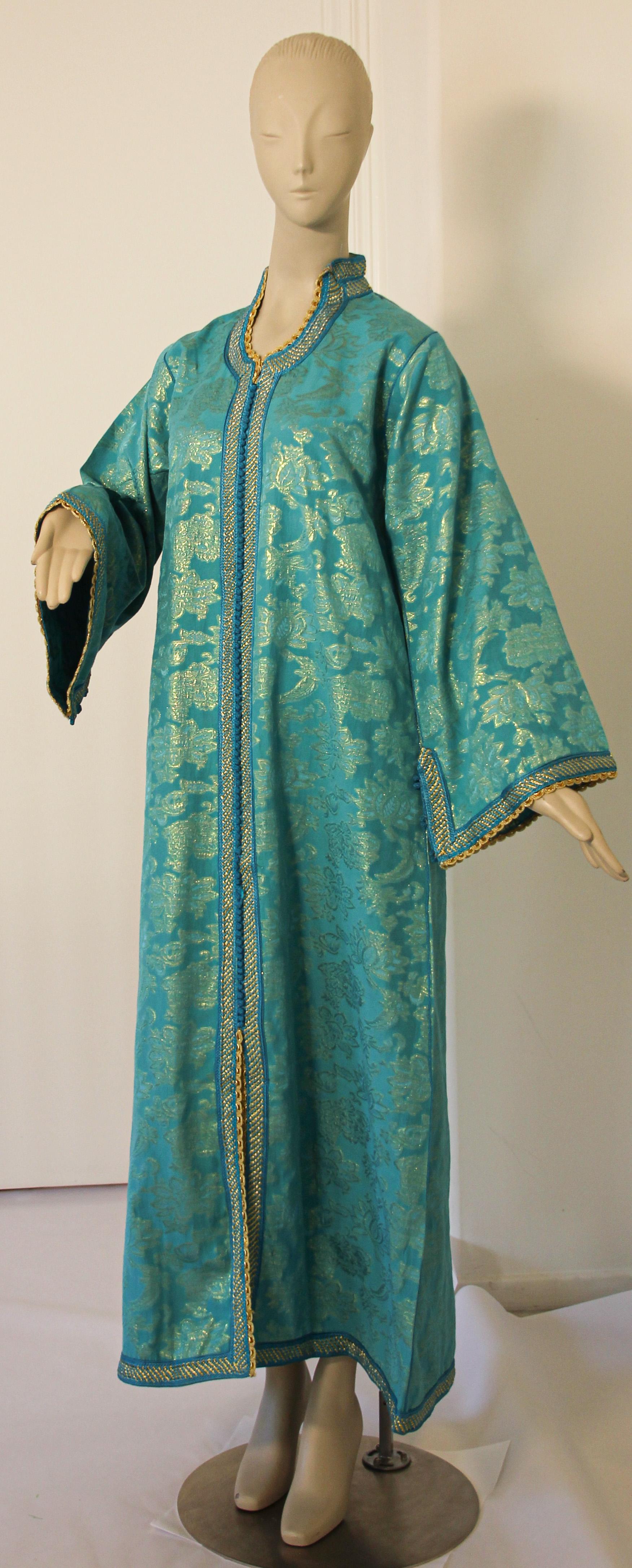 Elegant Moroccan caftan turquoise and silver lame metallic floral brocade,
This is an exceptional example of Moroccan fashion design dating to the 1970s, 
Handcrafted in Morocco and tailored for a relaxed fit with wide sleeves, It is made in the