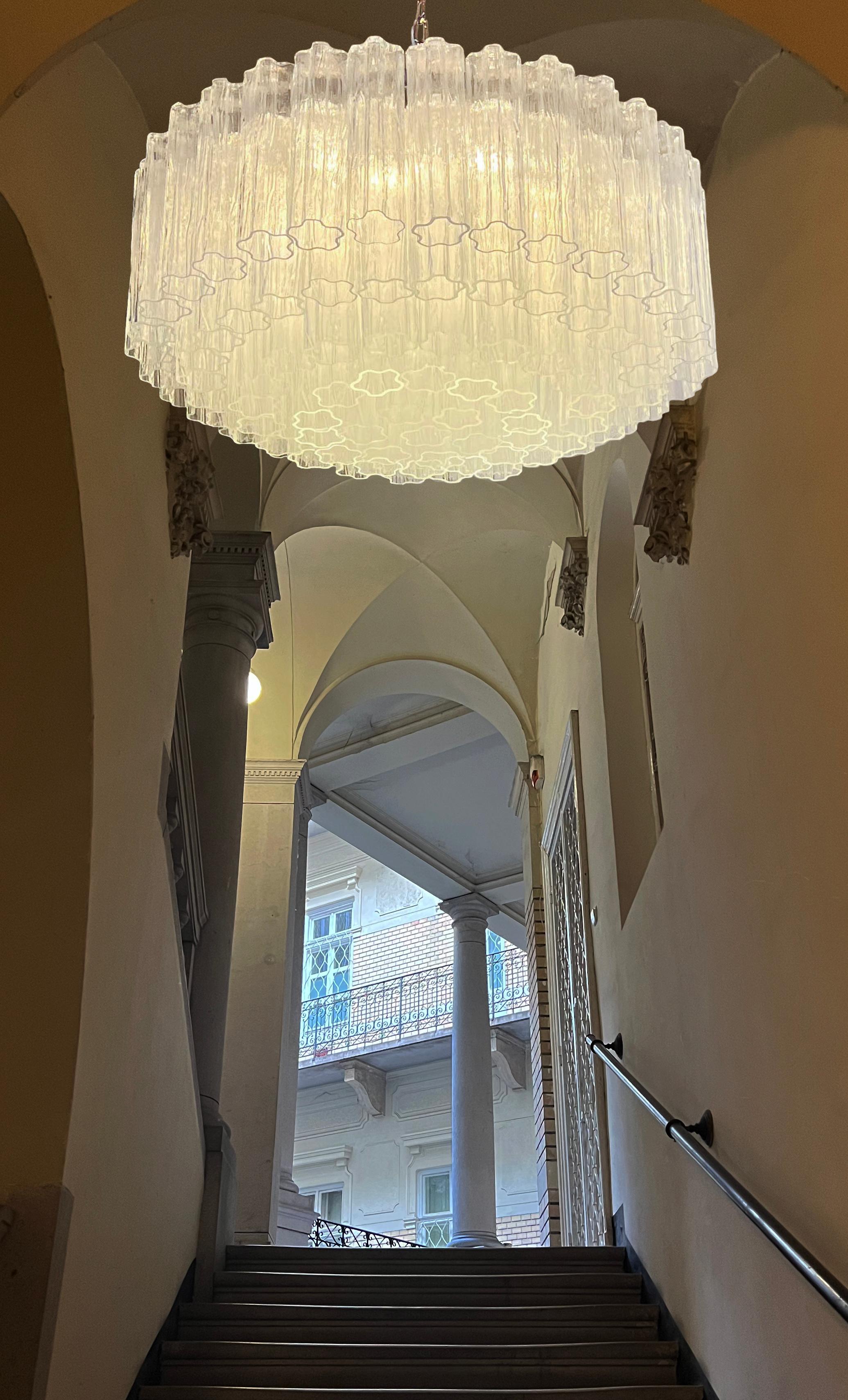 Italian vintage chandelier in Murano glass and nickel plated metal structure. The armor polished nickel supports 101 large clear glass tubes in a star shape. Can be used as a chandelier with chain, or as a ceiling light, the structure will be hung