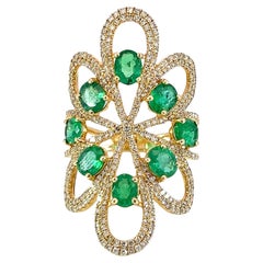 Elegant natural diamond and emerald ring