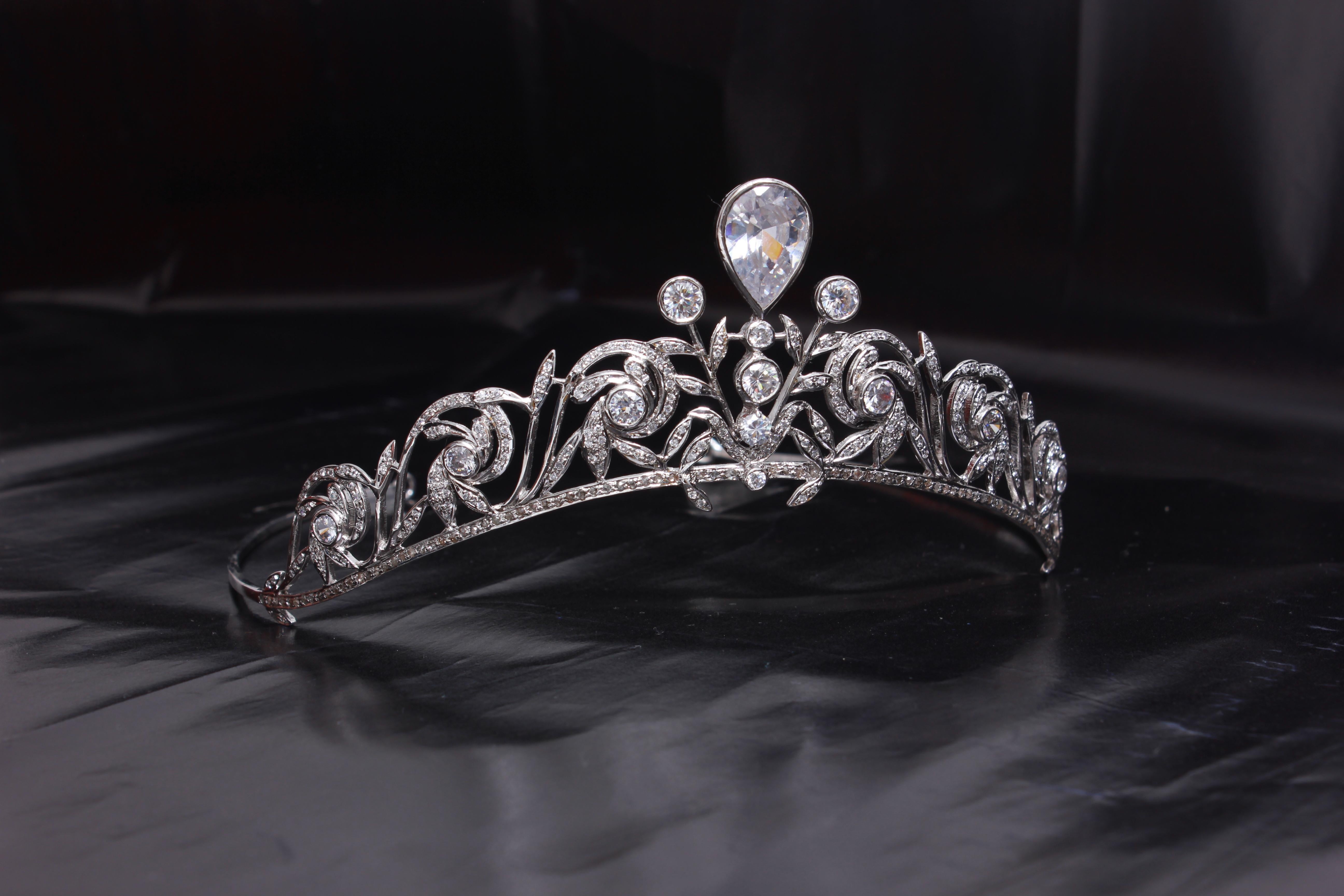 For the queen in you!
This royal tiara is a symbol of beauty and self-love. It is handmade with Natural pave diamonds and white topaz in sterling silver. 
Diamond- Pave diamonds
Diamond color- White with a tint of grey

Gemstone type- White