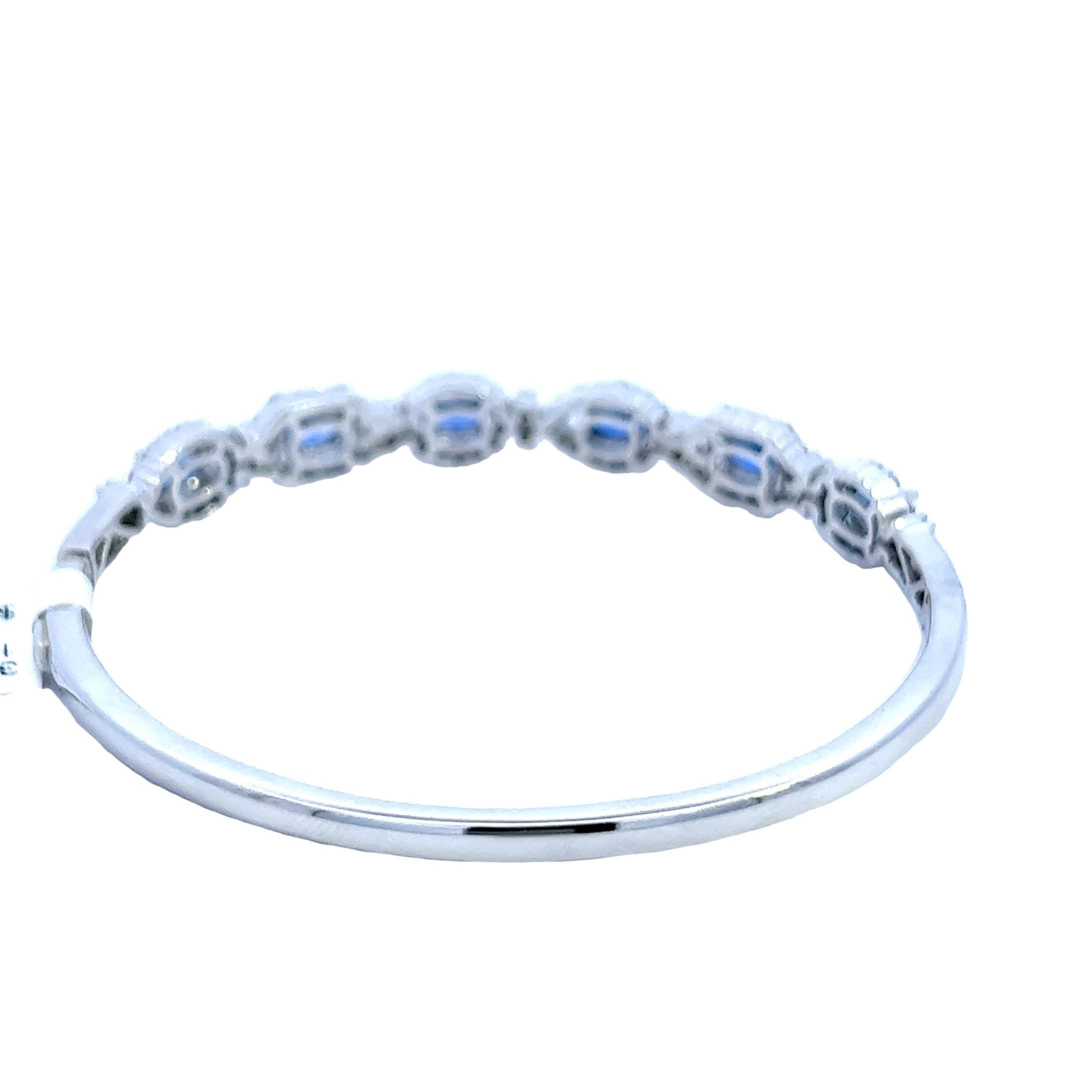 Oval Cut Elegant Natural Sapphire Bangle Bracelet with Round Diamond Accents  For Sale