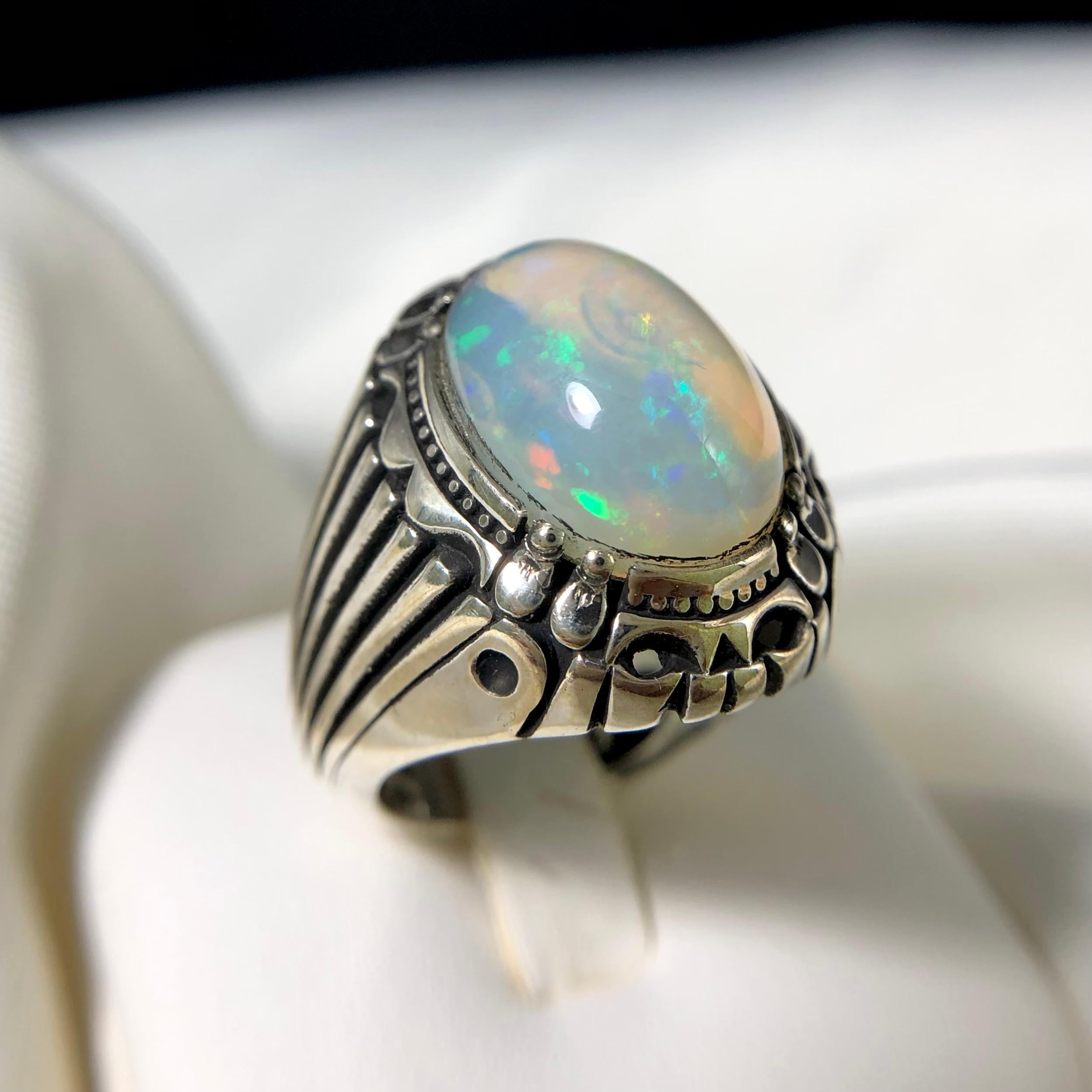 Elegant Natural White Opal Silver Ring Handmade with Play of Colors in a Magnificent Design!!

💎 GEMSTONE TYPE: Opal
⚖️ WEIGHT: 12.79 Grams
🪚 SHAPE & CUT: Cabochon Cut
💍 RING SIZE (US): 9.5
🌈 COLOR: White 
  METAL: 925 Sterling Silver
🔎