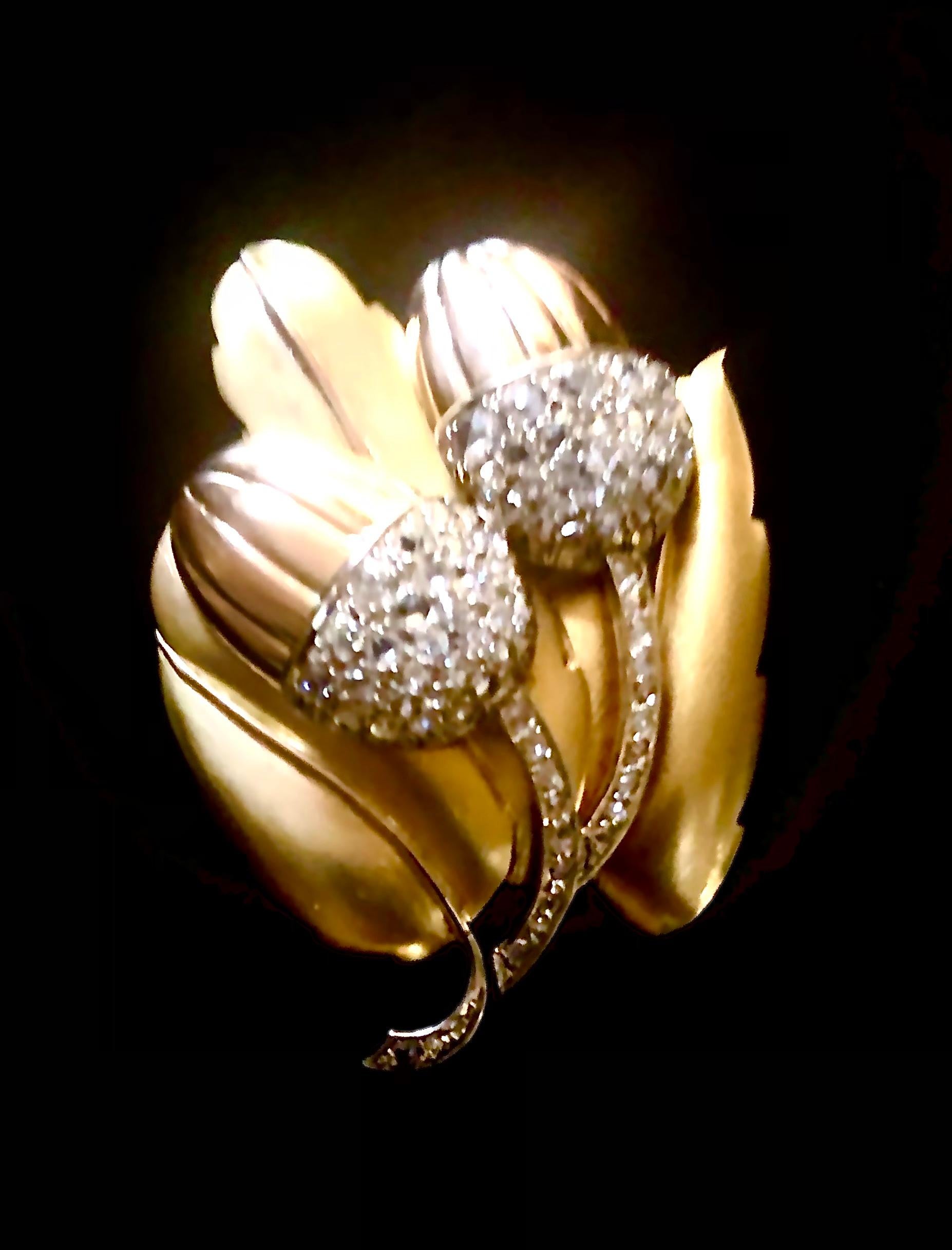 Elegant naturalist 14kt. Gold and brilliant white G-J SI-I diamonds of approximately 1.25 CTs.

The workmanship on this brooch is beautifully restrained relying elegant line and polished finishing of acorns and satin finish of leaves. And of course,